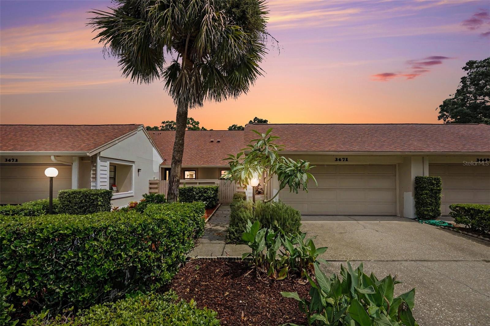Welcome Home to 3671 Imperial Ridge! This well-maintained 2-bedroom, 2-bath, 2-car garage villa offers the perfect blend of comfort, convenience, and low-maintenance living. As you approach the home, you'll be welcomed by a private courtyard. Step inside to a welcoming foyer that opens to a spacious living room featuring beautiful tile flooring, soaring ceilings, and a large sliding glass door leading to the enclosed lanai. Natural light fills the home, creating a bright and open feel throughout. The kitchen features dual windows, ample cabinetry, and a convenient eat-in space. The generously sized primary suite offers a walk-in closet and private en-suite bathroom. An added bonus is the inside laundry/utility room. The impressive 7' x 30' covered and enclosed lanai is truly a standout feature, offering plenty of space to relax or entertain while enjoying one of the nicest views in the community. This single-level villa features a thoughtfully designed floor plan with a seamless flow throughout. NO flood insurance required, NO CDD fees, and a low HOA fee make this an excellent opportunity. Ideally located just minutes from shopping, dining, and entertainment—approximately 10 minutes to downtown Dunedin and only 5 minutes to Countryside Mall—this home offers the perfect combination of location, comfort, and convenience. Don't miss the opportunity to make this beautiful villa your new home!