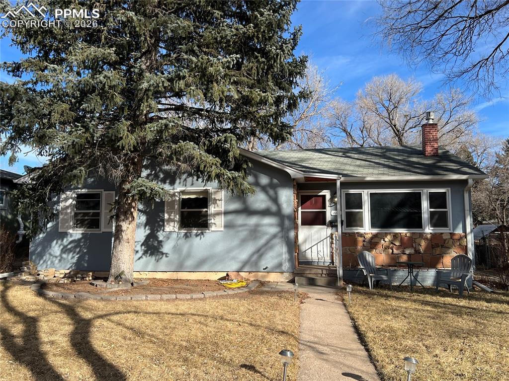 Welcome home to this quaint 1954 ranch-style gem in the heart of Colorado Springs. Offering 1,194 square feet, this well-loved home features 3 bedrooms and 1 full bathroom, blending classic character with everyday comfort. Natural wood floors and a cozy fireplace add warmth and timeless appeal, while central air keeps things comfortable year-round. The stucco and stone exterior reflects true Colorado style, and the detached 2-car garage, storage shed, and convenient alley access provide plenty of space and functionality. Set on a large, tree-filled yard, this property offers room to relax, garden, or entertain. Nestled in a quiet neighborhood just minutes from Garden of the Gods, Manitou Springs, Old Colorado City, and endless hiking trails, this home delivers both serenity and unbeatable access to the best of outdoor living and local charm.