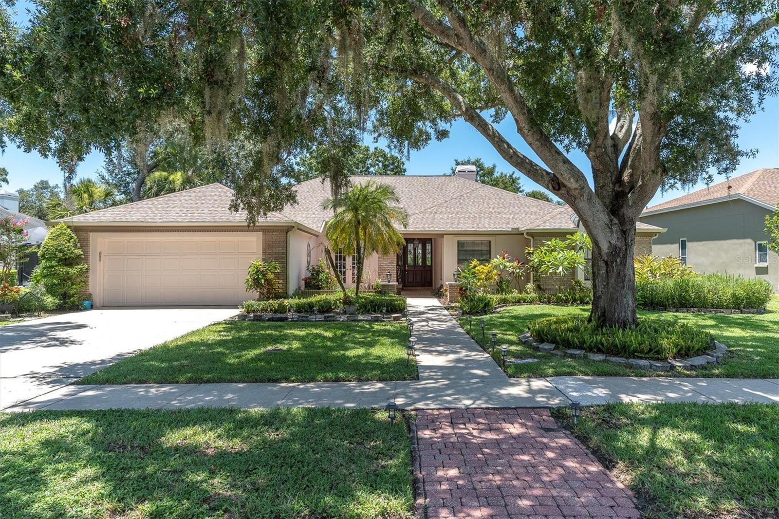 Back on Market – New Roof Just Installed! This stunning 4-bedroom, 3-bath POOL home with a serene water view is available once again in the Berisford section of the highly desirable Lansbrook community! After an extended pending period—during which the seller removed the solar panels and installed a brand-new roof—the home is ready for new buyers. (Note: The solar panels will not be reinstalled, and the previous solar lease agreement will be terminated by the seller.) Step inside to find a spacious, welcoming living room with a cozy wood-burning fireplace and triple pocket sliders that open to a gorgeous water view—creating an unforgettable first impression. The formal dining room features custom built-ins and double French doors that lead to a charming front patio. The heart of the home is the beautifully updated kitchen with quartz countertops, a farmhouse sink, center island, and breakfast bar. Natural light pours in from the windows overlooking the lanai, and the kitchen seamlessly opens to the family room and casual dining space, complete with a built-in coffee or beverage bar. The outdoor living area is a private retreat, boasting a sparkling pool and spa, outdoor kitchen, and lush landscaping—perfect for entertaining or relaxing in style. The spacious primary suite includes a luxurious ensuite bath with dual vanities, quartz counters, soaking tub, and walk-in shower. Three additional bedrooms and two more full baths offer plenty of space for family and guests or an office/craft room.Luxury vinyl plank flooring runs throughout the main living areas, primary suite, and two guest rooms. Additional features include: Inside laundry room with sink, A/C 2017, Hot water heater 2018, new pool pump 2024, Roof with new leaf guards May 2025. Residents of Lansbrook enjoy access to Lakefront Park, scenic walking trails, volleyball and basketball courts, playgrounds, a pavilion, and a private community boat ramp and dock. All just minutes from top-rated schools, shopping, dining, and Lansbrook Golf Course. Don’t miss this rare opportunity to own a move-in-ready home in one of the most sought-after communities in Pinellas County. Schedule your private showing today!