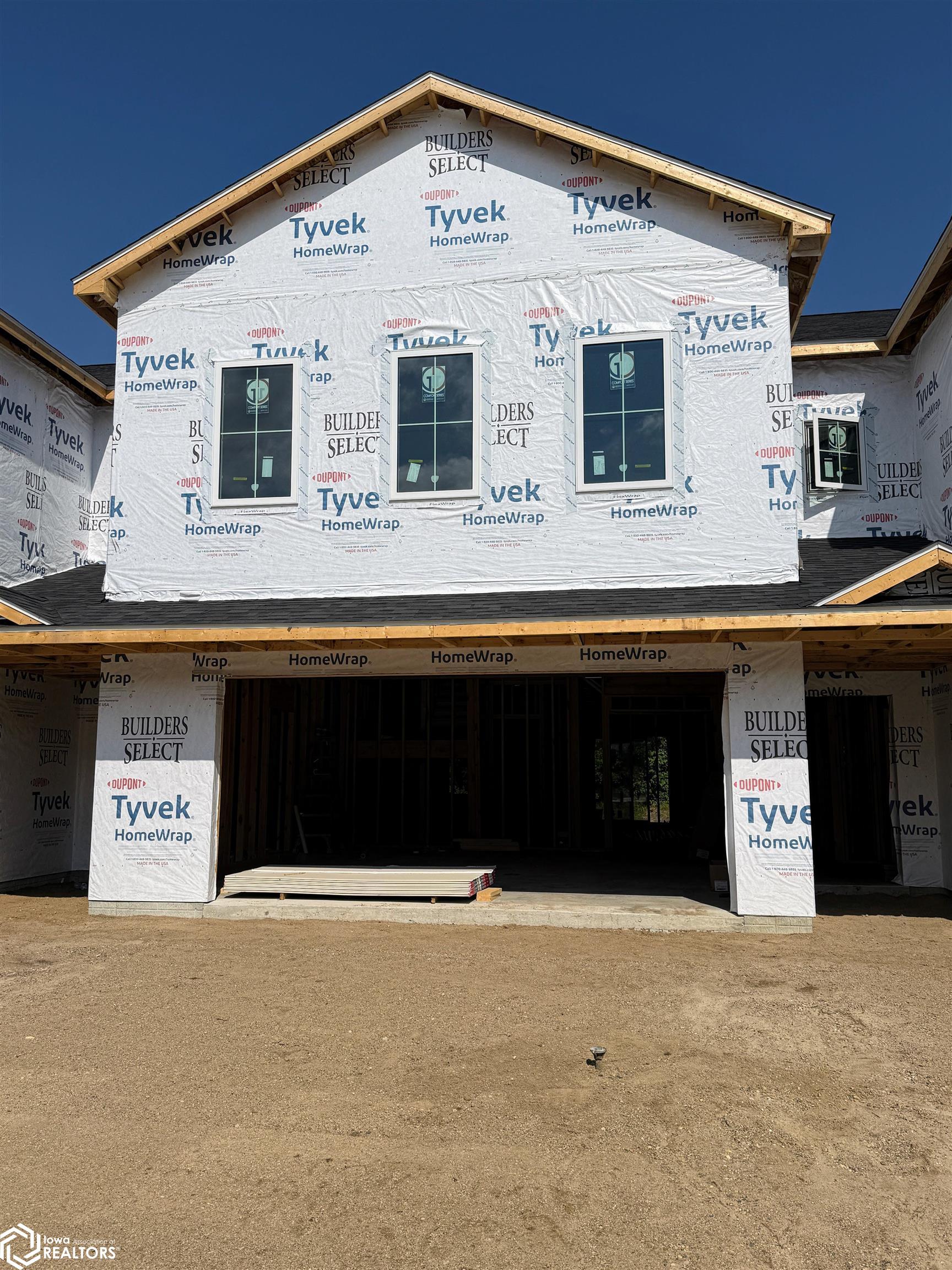 Framing is up on Building 2 at StoneBrook Condominiums—your finishes, your style! Only five units remain, one already sold. Each 2200 sq ft, 3-bedroom, 3-bath condo includes a heated 2-stall garage, private patio, and versatile loft for office or lounge space. The main floor features open-concept living with 9’ ceilings, shiplap gas fireplace, quartz countertops, custom cabinetry, solid-core 3-panel doors, and LVP flooring. The kitchen offers a central island and walk-in pantry. Upstairs, the primary suite includes dual closets, an ensuite with dual vanities and a tiled shower, while the additional bedrooms share a Jack & Jill bath. Bonus features: laundry room with built-ins, in-floor heat on main level and garage, on-demand water heater. HOA covers lawn care, snow removal, garbage, sewer, and exterior maintenance. Includes 5-Year Tax Abatement and optional Freedom Boat Club membership. Near All Vets Golf, McIntosh State Park, and Hwy 18W. Call today—choose your finishes and secure your new home!