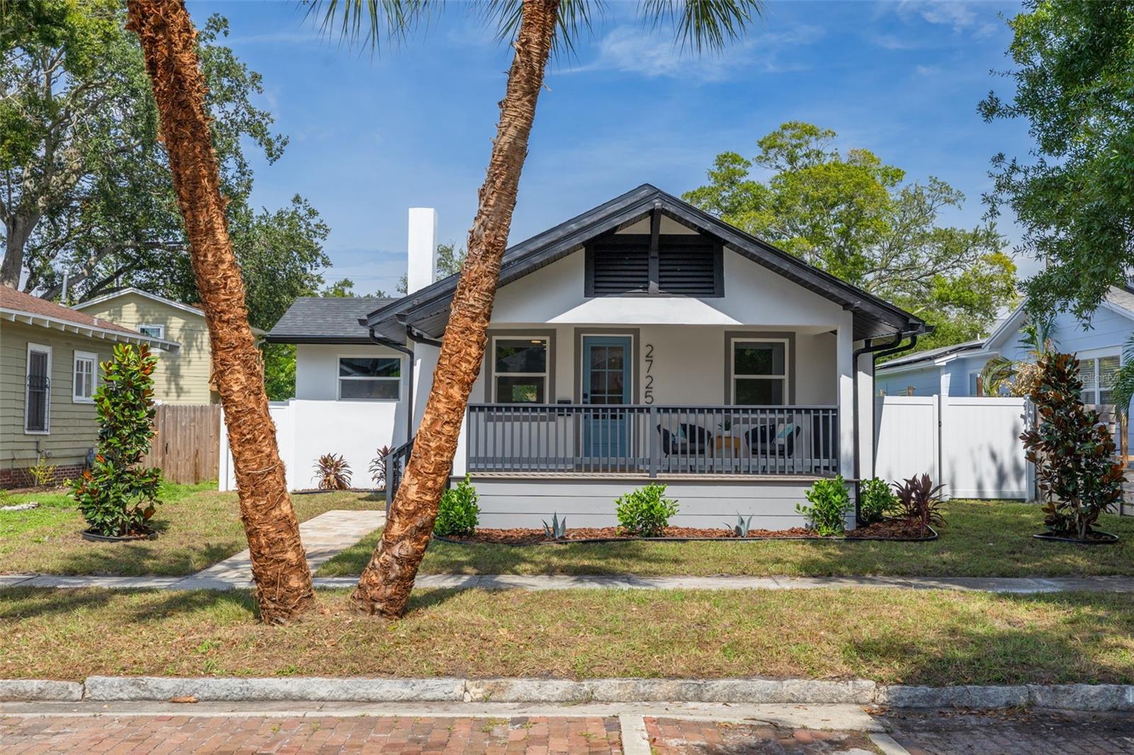 Welcome to this beautifully reimagined single-level residence in the highly sought-after Palmetto Park neighborhood! Completely remodeled from top to bottom, this exceptional home offers the peace of mind and comfort of virtually new construction, featuring all-new plumbing, electrical, HVAC, roof, and impact-rated windows and doors. Expanded with a substantial addition, this 3-bedroom, 3 -bathroom home boasts a bright open-concept floor plan designed for modern living and effortless entertaining. The stunning chef’s kitchen & serving bar serves as the heart of the home, showcasing quartz countertops, new appliance package, designer finishes, and abundant cabinetry. Retreat to the sprawling primary suite, complete with a luxurious spa-inspired bathroom with large walk-in shower, free-standing tub, walk-in closet with built ins and generous bedroom space. Additional highlights include a dedicated indoor laundry room, a two-car garage, and thoughtfully curated designer touches throughout. Situated on a 50' x 127' lot, the expansive backyard offers plenty of room to add a pool and create your own private outdoor oasis. Charming front and rear porches provide the perfect spaces to relax and enjoy Florida living year-round. Nestled on a picturesque brick lined street witih granite curbs and sidewalks in one of St. Petersburg’s most desirable neighborhoods, this home is just minutes from Downtown St. Petersburg, Central Avenue’s vibrant dining and entertainment scene, and the beautiful Gulf beaches. This is a rare opportunity to own a turnkey home with the character of an established neighborhood and the quality of new construction. Schedule your private showing today!