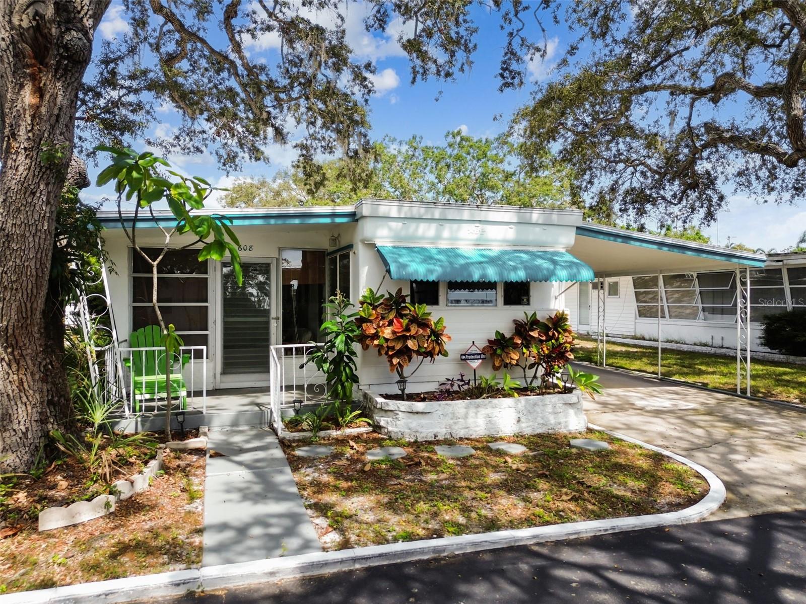 South Gate 55+ Community! Fully furnished 3BR/1.5BA home featuring brand new luxury vinyl plank flooring, shaker cabinets, butcher block countertops & New stainless steel appliances, Roof 2018, and Newer water Heater. Spacious layout filled with enclosed porch with natural light. Monthly fee of $245 includes water, trash, lawn care & access to heated pool, shuffleboard & clubhouse with activities. Golf cart & motorcycle friendly. Share value $48,000 included in sale price. Convenient Clearwater location close to beaches, shopping, dining, Tampa International Airport & downtown St. Pete. Perfect for year-round or seasonal living with rental potential. Approval required.