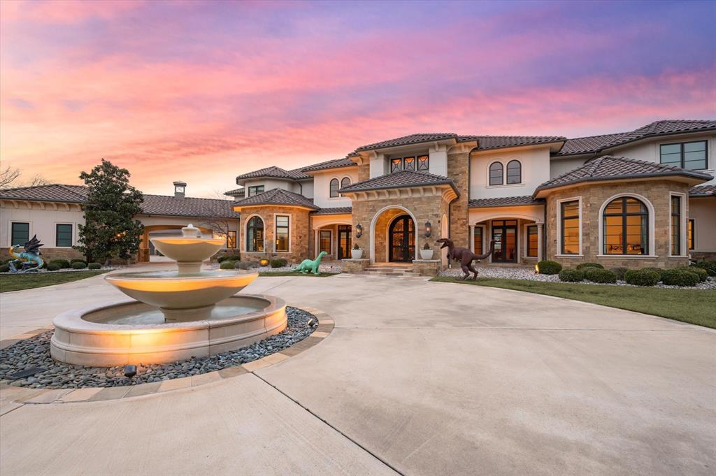 A True Southlake Masterpiece in Prestigious Carroll ISD. Set behind private gates on 4.83 immaculate acres, this breathtaking estate redefines luxury living in one of Southlake’s most coveted enclaves. Designed for both grand-scale entertaining & everyday indulgence, the residence blends timeless sophistication with an extraordinary array of world-class amenities. A sweeping circle drive introduces the stately motor court & 6-car garage, while the resort-inspired grounds invite leisure at every turn—featuring an indoor sports court, sparkling oversized pool & spa, multiple alfresco lounges, a full outdoor kitchen, & dramatic stone fireplace. Every space has been envisioned as the ultimate private retreat for relaxation & entertainment. Inside, artistry & craftsmanship abound. An elevator offers seamless access across levels, while the entertainment wing showcases a game room with wet bar, & a tiered theater, designed for unforgettable moments with family & friends. Wellness & productivity are equally prioritized with a private gym & dual executive offices, each outfitted with custom millwork. The palatial Owner’s Retreat is a sanctuary of its own, complete with a spa-inspired bath, dual custom closets (hers with stackable washer-dryer), & a tranquil ambiance that rivals the world’s finest resorts. Two main-level guest suites provide comfort & privacy, while upstairs offers 5 additional en-suite bedrooms & 2 living areas for ultimate flexibility. At the heart of the home, the gourmet kitchen is a culinary haven boasting commercial-grade gas cooking, dual dishwashers, built-in refrigeration, double ovens, warming & cooling drawers, & both a butler’s pantry & walk-in pantry designed for effortless entertaining. Exuding elegance, exclusivity, & modern convenience, this estate presents a once-in-a-lifetime opportunity to own a private Southlake sanctuary of distinction. A residence that must be experienced in person—schedule your private tour today.