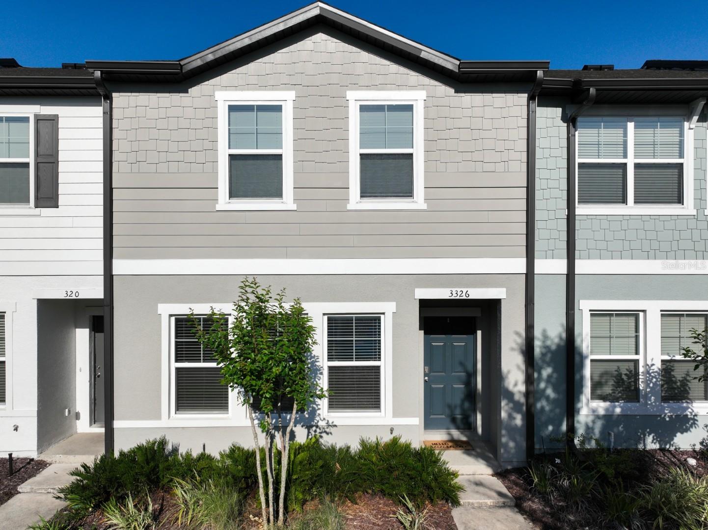 One or more photo(s) has been virtually staged. ** Featuring an UPGRADED, FULLY TILED 1st Floor (plus) KITCHEN ISLAND w/GRANITE Breakfast Bar Seating that matches the Kitchen Cabinetry - this move-in ready Town Home is the best buy in Bay Lake Preserve ** Street/Curb parking fronts the Town Homes with 1-car GARAGE in rear (alley access) ** The Spacious Great Room provides ample living space, adjoined by the Beautiful Kitchen w/Breakfast Bar Seating.  All Appliances Convey and are in LIKE-NEW CONDITION ** The Powder Room is located off kitchen, as well as garage access and rear door.  GARAGE UPGRADED with COATED FLOORING ** The 2nd-floor Bedrooms have generous sizes, including a VERY LARGE PRIMARY BEDROOM, featuring a HUGE WI CLOSET w/Built-in Shelving ** The Spare Bedrooms share the secondary bathroom featuring tub with shower ** The Laundry Closet is conveniently located on the 2nd level, and Washer/Dryer convey ** Bay Lake Preserve is conveniently located off of John Young Pkwy., with reasonably quick access to shopping, I-4, SR 408, Florida Turnpike, Central Florida Attractions and access to all points of Central Florida ** Room sizes are approximate and may be verified by buyers ** Be sure to view all photos and 3-D Walk-through tour!