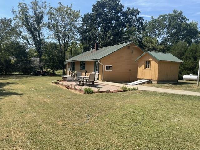 Discover peaceful country living on this beautiful 10-acre property just outside Butler. This well-kept 3-bedroom home offers updated exterior siding and paint, a durable metal roof, and a newly finished bedrooms for added space and comfort. Inside, you’ll find a renovated bathroom, fresh interior updates, and a brand-new hot water heater. Recent floor joist, electrical and plumbing improvements provide confidence and long-term reliability.Outside, the land is open, usable, and ready for livestock, hobby farming, or simply enjoying the quiet countryside. A 20×30 detached garage, additional small shop, and two bay sheds offer excellent storage and workspace for equipment, tools, or recreational gear. The property sits on paved State Route D, providing easy access to Butler, Adrian, and surrounding communities while still delivering the privacy and freedom of rural living. Approximately 25% of the acreage is tillable ground, ideal for food plots or small-scale farming, while the remaining 75% is mature timber providing excellent wildlife habitat, privacy, and prime hunting opportunities. It's under a 1-hour drive to Kansas City for other activities or work. Whether you’re starting a homestead, downsizing to acreage, or looking for a weekend retreat, this property offers the perfect blend of comfort, updates, and usable land.