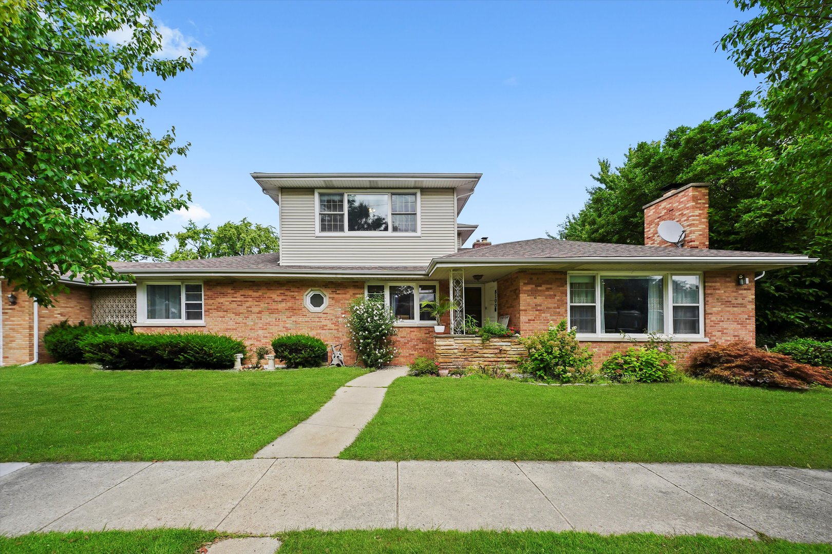 Welcome to your forever home-where space, comfort, and location come together in perfect harmony. A rare find in highly desirable Skokie, this expansive home is situated on a double lot and offers an incredible amount of space both inside and out. Boasting 7 bedrooms and 3 full bathrooms, this unique property is perfect for large or extended families. The main level features a welcoming living room with a fireplace, a separate formal dining room, and 4 generously sized bedrooms-most with spacious walk-in closets. The kitchen is equipped with stainless steel appliances, ample cabinet and counter space, and a large eating area ideal for everyday dining. Upstairs, you'll find a cozy family room, an additional bedroom, and a full bathroom-perfect as a private retreat or guest suite. The finished basement further expands the living space with a large recreational room, a full laundry room, and two more bedrooms, offering excellent flexibility for guests, in-laws, or a home office setup. An enclosed breezeway/screened porch connects the home to a generous brick 2.5-car garage, and the maintenance-free yard features a patio ideal for outdoor entertaining. Located just a short walk to top-rated schools and beautiful parks, and only minutes from shopping, dining, and public transportation-this is Skokie living at its best. Don't miss this one-of-a-kind opportunity!