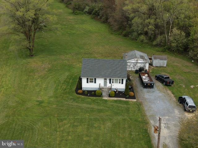 Nestled in highly desirable Upper Pittsgrove Township, this charming 2-bedroom 1 bath home offers the perfect blend of privacy and potential on a sprawling 3.04-acre property. Surrounded by open space and natural beauty, this property provides a peaceful country-like setting while still being conveniently located to nearby amenities. Inside you will find 960 sq ft to be cozy with a functional layout, comfortable living space open to a eat in kitchen making it feel open and spacious. On the main level is a good-sized bedroom and a large bathroom. The upper level offers a large spacious bedroom, with the potential to be 2 rooms. The home also has a full basement with walk out access, and a 2-car detached garage. Whether you're looking for a starter home or downsizing this home delivers. The expansive acreage is ideal for outdoor enthusiast, gardening, hobby farming, or simply enjoying the open space. With endless possibilities, this property is the opportunity to own your own slice of tranquility in a sought-after location.