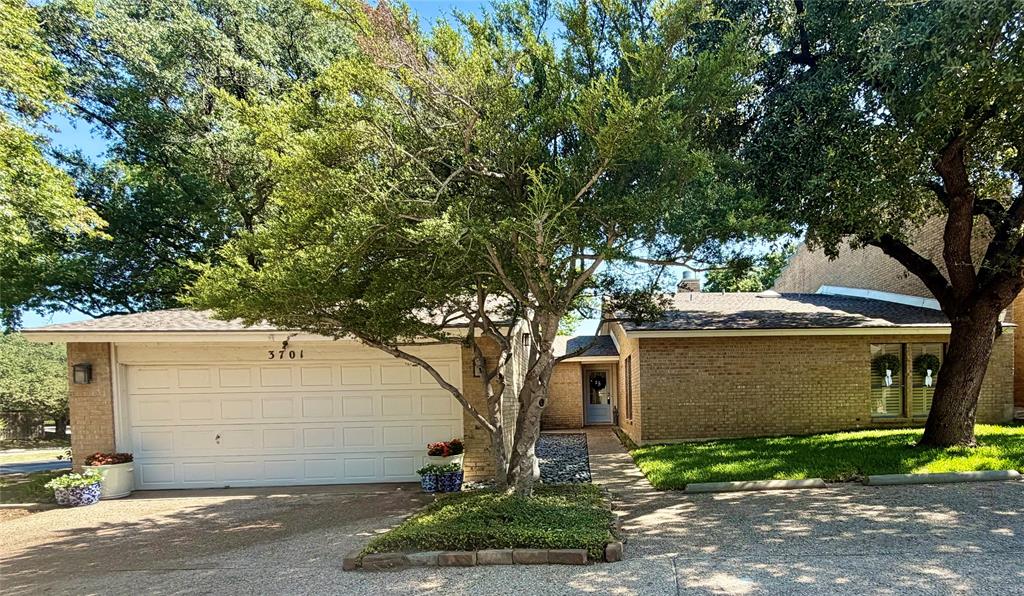 RARE SINGLE-STORY offering 3-oversized bedrooms, 2-bathrooms, 3 living rooms Beautifully updated, showcased with stunning nailed-down white oak hardwood floors wall to wall! The sleek kitchen boasts leathered granite countertops, custom cabinets, and seamlessly connects with the living and dining areas in a bright, open floor plan enhanced by vaulted ceilings and abundant natural light. Thoughtful design touches include exposed brick walls in the formal dining room, sunroom, primary suite, and a secondary bedroom, along with recessed lighting on dimmers throughout the home to set just the right mood. The owner's retreat features a spa-like bath and a generous walk-in closet, complemented by exceptional storage throughout the home including full wall of custom built-in-cabinetry in secondary bath. 2 car garage includes two garage closets, with floored attic.Step outside to a covered patio overlooking a serene backyard—ideal for morning coffee or unwinding at day’s end. Enjoy the peace of mind that comes with a 2023 roof and HVAC system. Located just minutes from The Colonial, TCU, Clear Fork, University Park, and the scenic Trinity Trails. Beautifully renovated offers the best of Fort Worth living on a corner lot surrounded by mature trees and peaceful garden spaces with perfect blend of charm, comfort, and convenience.