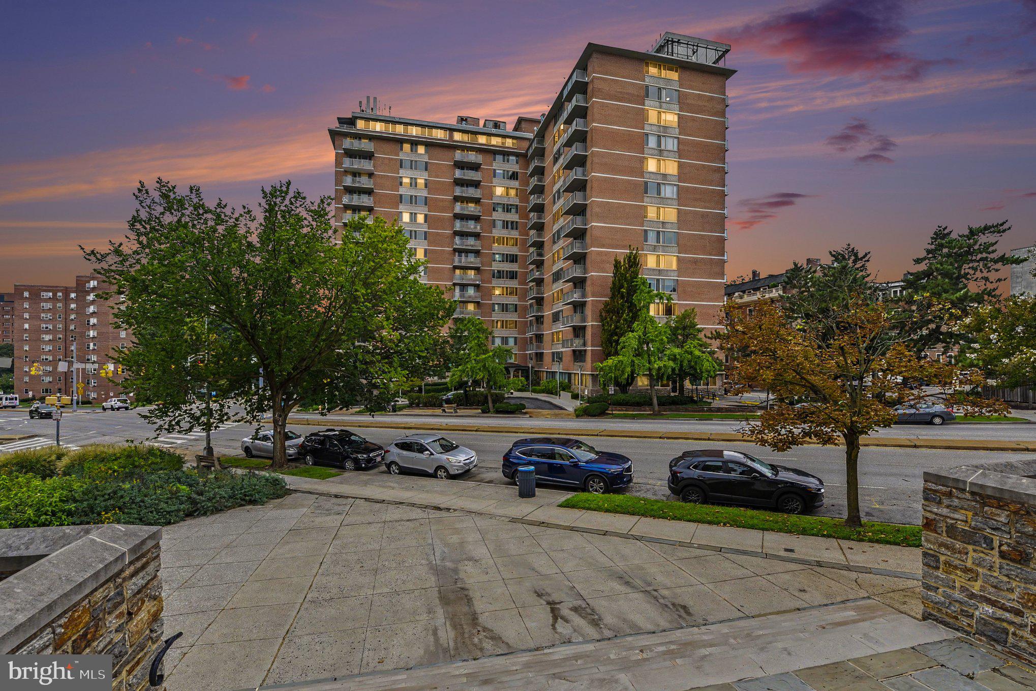 City Living at its best with gorgeous city views!! Secure Building!!  Light filled 2 bedroom 2 bath furnished unit with a balcony.. Both bedrooms have Queen bed, dresser, nightstand & desk.. Owners suite offers a private bathroom and walk in closet!!  Building offers a gym, community center and roof top Pool!! Condo fee includes Electric, Water, Maintenance to include batteries in smoke detectors, changing filters, Preventative Pest management.. Just bring your clothes!!  Walking distance to Johns Hopkins University.. Building has a large shared laundry room.. Garage Parking available for rent!! Unfortunately this building does not allow pets