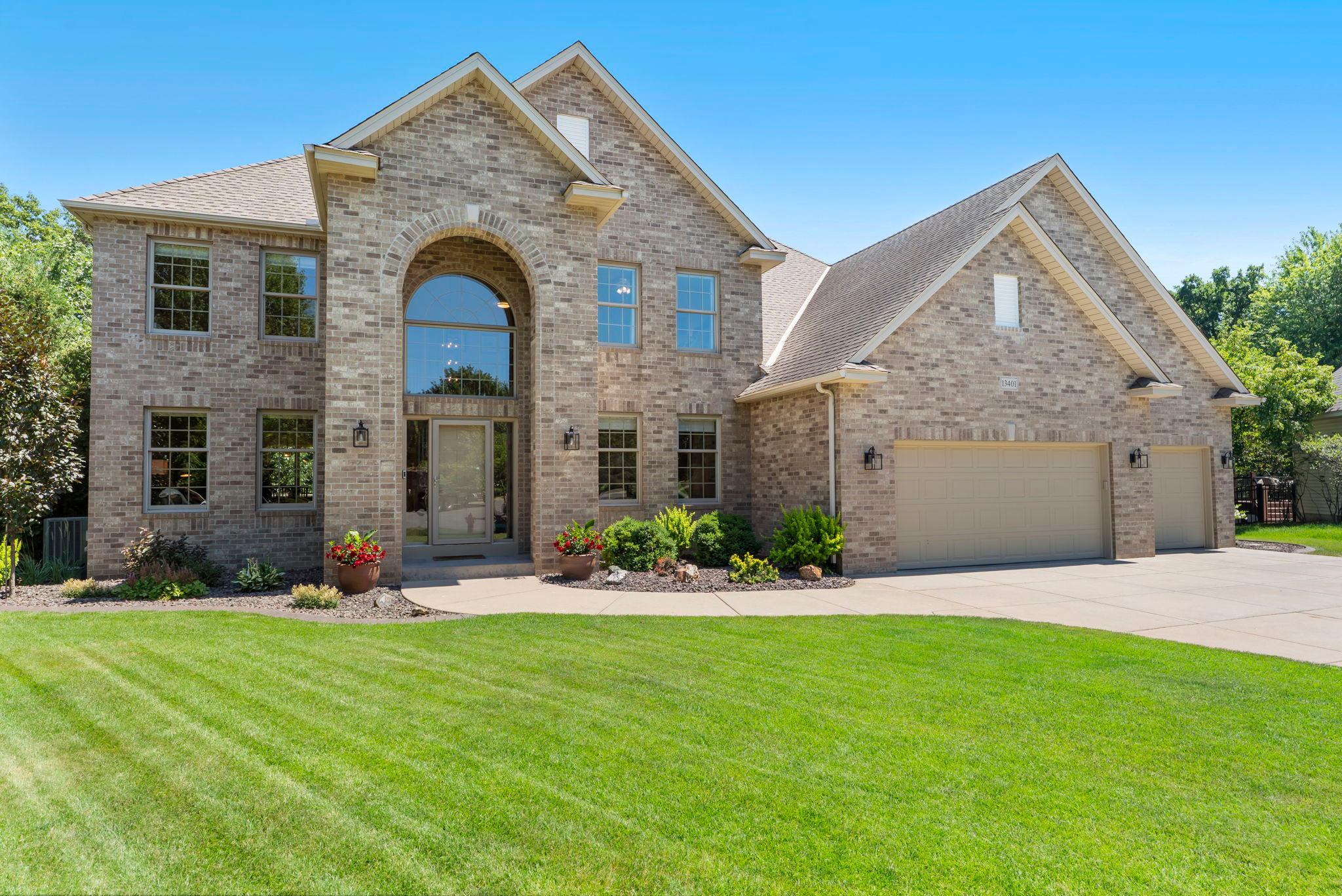 Welcome to this stunning, meticulously maintained 4-bedroom, 5-bathroom home on a quiet cul-de-sac in sought-after Rosemount School District 196. Ideally located within walking distance of Shannon Elementary, parks, and trails, with shopping, dining, and everyday amenities nearby. The inviting foyer features soaring 18-foot ceilings and opens to a bright sitting room and private office with French doors, built-in desk/storage, and new carpeting. The remodeled kitchen (2018) is a chef’s dream with expansive quartzite countertops, center island with breakfast bar, abundant white cabinetry with under-cabinet lighting, pantry, and stainless steel appliances including gas cooktop and exterior-vented hood. The informal dining area opens to the spacious maintenance-free deck through Anderson patio door replaced in 2023. A formal dining room and generously sized living room with new carpeting, gas fireplace, and large windows complete the main living spaces. The main level also features a convenient laundry/mudroom, half bath, and oversized heated 3-car garage. Upstairs, four bedrooms are conveniently located on one level. The luxurious primary suite features 10-foot vaulted ceilings, new carpeting, a remodeled ensuite (2024) with dual marble vanities, illuminated mirrors, oversized tiled walk-in shower, separate water closet, and access to a 12x9 walk-in closet with stacked LG washer/dryer. Bedroom two includes a private ¾ bath, while bedrooms three and four share a Jack-and-Jill full bath. The lower level is designed for entertaining with a spacious recreation room, wet bar with seating, beverage refrigerators and wine storage, ¾ bath, and family room featuring a stone-surround gas fireplace, built-in entertainment center, and walkout access to the backyard. The private, fully fenced backyard is an entertainer’s dream, surrounded by mature trees and beautifully landscaped grounds. Enjoy the expansive patio with hot tub, underground heated pool, maintenance-free deck, large pool deck with raised secondary deck, and an additional outdoor patio with wood-burning fireplace and built-in grill. A gravel play area with playset provides additional recreation space. Notable updates include new carpet and interior paint throughout, replaced entry doors and light fixtures, siding repairs (2026), primary bathroom remodel (2024), Anderson patio doors (2023), and kitchen remodel (2018). Exceptional indoor and outdoor spaces, thoughtful updates, and a prime Rosemount location make this home truly a must-see!