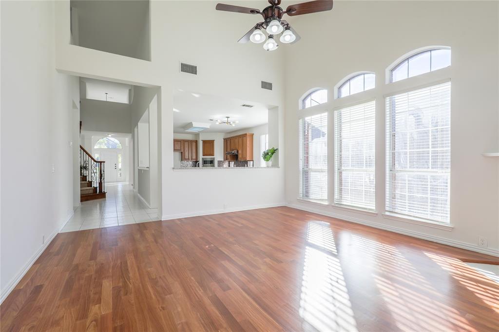 New roof and gutters coming in early Dec! Gorgeous 5-bedroom, 3.1-bath home in the highly sought-after Knolls at Russell Creek with exemplary West Plano schools. Freshly painted throughout with updated lighting and an open floor plan featuring high ceilings in the living room and entry. Two living areas and a master suite are downstairs, with the family room easily used as a study. The kitchen offers granite countertops, vented range hood, new oven and microwave, and plenty of storage. Upstairs includes a large game room, four bedrooms, and two baths. Features include nailed-down Santos mahogany hardwood floors, wrought-iron staircase, and 8-foot board-on-board fence. Convenient location near highways, shopping, and restaurants. Move in Ready! Wonderful amenities including the pool, trails and parks.