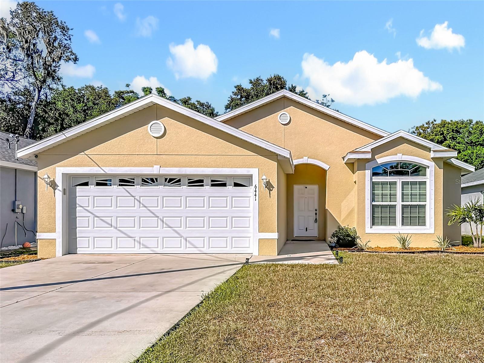 Built in 2020, this beautiful 3-bedroom, 2-bath home offers a bright open layout with a spacious living and dining area, a modern kitchen with stainless steel appliances, pantry, breakfast bar, and plenty of natural light. The primary suite features a walk-in closet, double sink vanity, linen closet, and walk-in shower. Enjoy outdoor living with a covered and screened porch overlooking a large backyard—perfect for relaxing or entertaining. Additional features include a laundry area, 2-car garage, and no HOA fees. Conveniently located near supermarkets, restaurants, shopping, and major highways, this move-in ready home combines comfort, style, and freedom in a prime location!