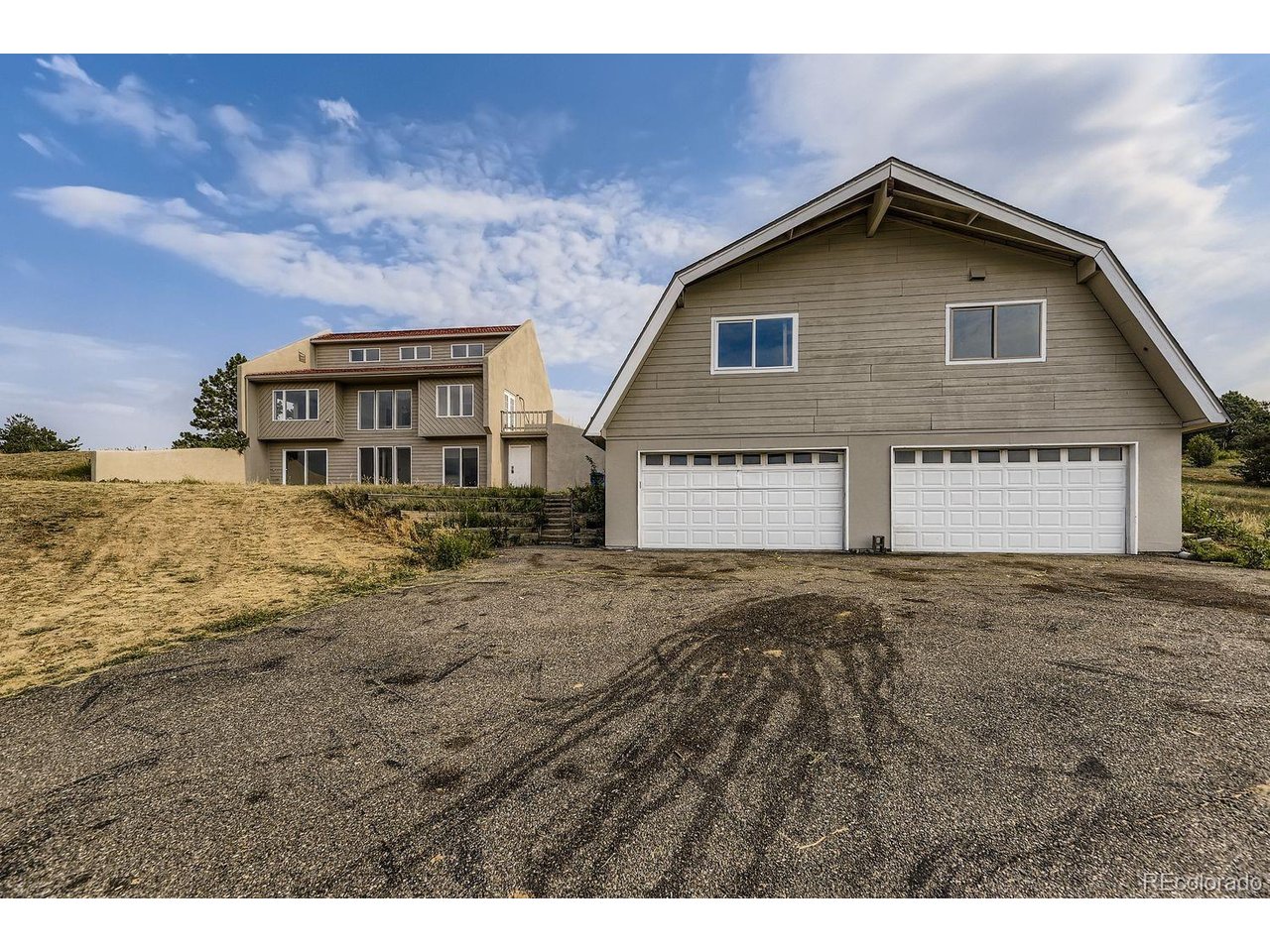 Fully remodeled custom home on 1.87 acre corner lot located in the middle of highly desired Foxfield neighborhood, right on the hill with the mountain/valley views! There are no HOA restrictions within this gated traffic controlled community. Open floorpan featuring large family room with high ceilings and access to the patio* Fully remodeled kitchen with updated cabinets, slab granite, backsplash and stainless steel appliances* Second floor featuring primary suite with fully remodeled primary bathroom with stairs to the loft and walk in closet, and additional two bedrooms with remodeled full bathroom and access to the balcony * Lots of updates including new paint inside and outside, new exterior stucco, new roof on top of the garage, flooring, light fixtures, plumbing fixtures, kitchen appliances, remodeled kitchen and bathrooms etc South facing home with double insulation utilizes solar energy to warm up the house in the winter time and to stay cool in the summer minimizing consumption of energy* Home featuring in room air-conditioning/heating units and it has radiant heating on both levels* There is a well that has not been used by current homeowner, but could potentially be used for irrigation and there is city water for household use. This home is on a septic system* Four cars detached oversized insulated garage with water and electricity connection, with the same size space above which could be used as a work shop area or storage etc* This property features two separate entrances. Ready to move in and enjoy quiet life in hidden jewel of Denvers gated desired community!