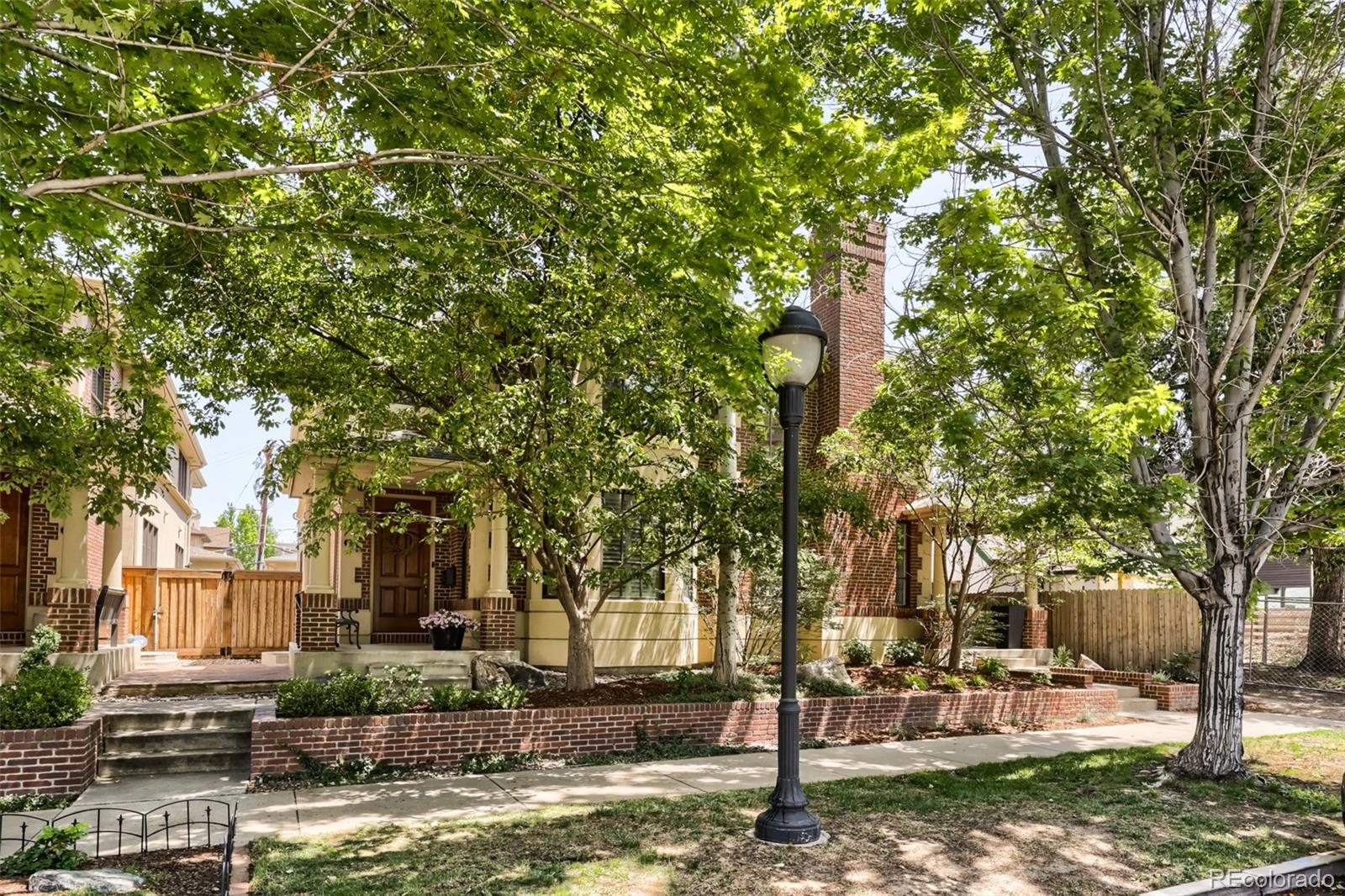 An extraordinary expression of modern luxury, this remodeled Cherry Creek townhome blends sophisticated design with effortless livability.  A stunning two-story entry highlights a spacious living room, six inch/plank walnut floors, custom millwork and designer lighting throughout. The chef's kitchen is a true showpiece, featuring an oversized center island, custom cabinetry, premium Viking appliances including double ovens and a six-burner cooktop!  The open floorplan flows into a cozy great room with gas fireplace plus easy access to a private patio perfect for al fresco dining.  The dramatic staircase leads to a loft-style office, exercise area or flex space perched above the entry.  The primary suite serves as a private sanctuary with a two-way fireplace, spa-inspired bath featuring quartz countertops, dual vanities, freestanding soaking tub, oversized shower and an expansive walk-in closet.  The secondary bedroom is en suite, providing comfort, privacy and a full bath. The finished lower level was designed for entertaining, complete with a home theater and impressive full bar featuring,  cooler drawers, ice maker + wine cooler. Guests will enjoy a private suite with spa-like bath including steam shower! Perfectly positioned in Cherry Creek, this turnkey residence offers an unmatched combination of comfort, elegance and lifestyle!
