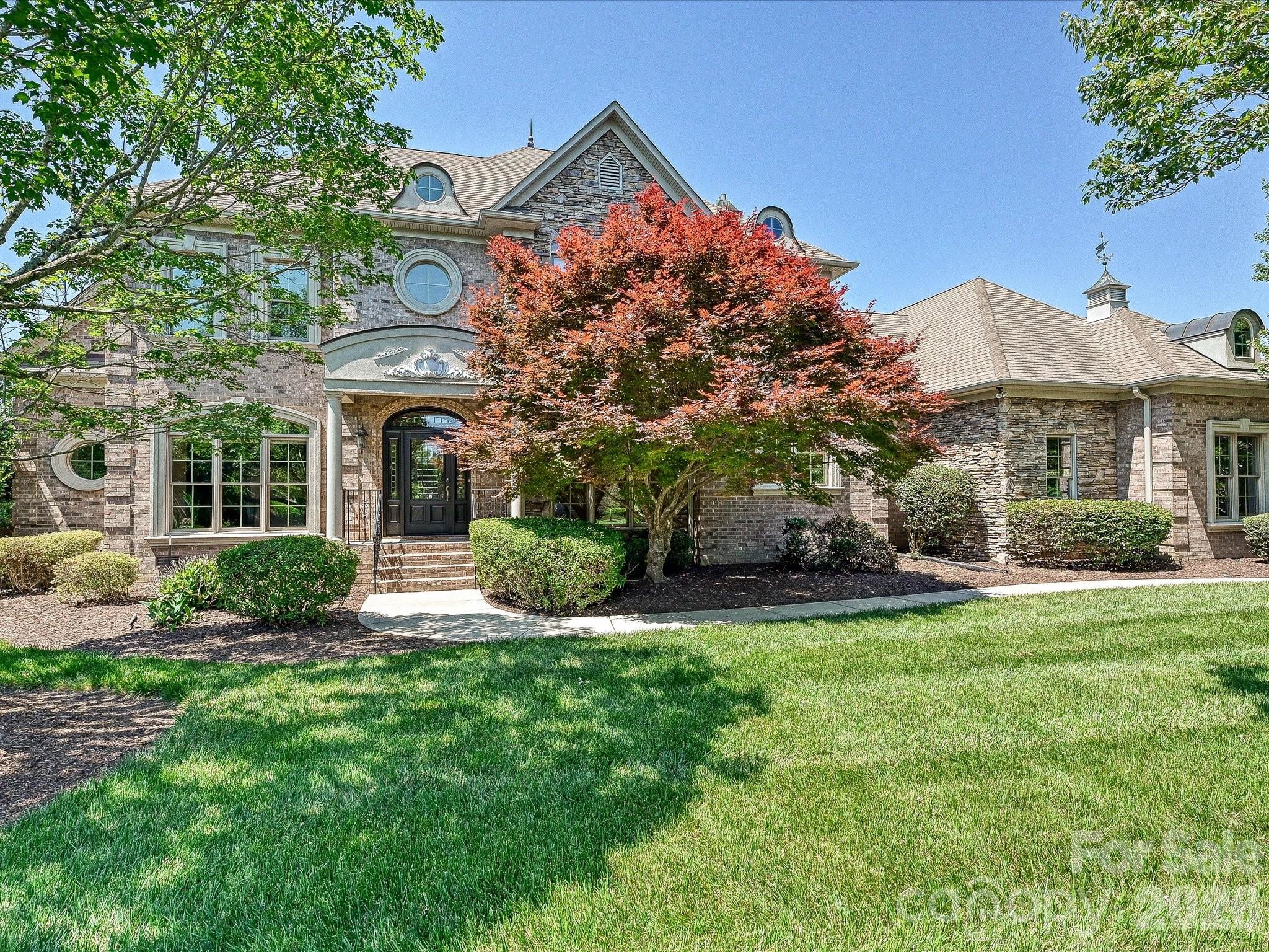 This exquisite ?5-bedroom, 3.?2-bathroom home, ?i?n the sought after gated community of Providence Downs South, with generous amenities & located in a top-rated school district, this home offers the perfect blend of elegance, comfort, & convenience. Inside, architectural details create a sophisticated atmosphere starting with the stately office with ?a coffered ceilin?g and built in shelves and cabinets. ?The family room has a fireplace and is open to the dining area and has a wall of glass doors that open on to the terrace and the backyard. The primary suite is complete with ?a?ccess to the covered terrace and a  spa-style bathroom with dual walk in closets?, dual vanities, jetted tub and stand alone shower. Upstairs, you’ll find three spacious bedrooms—one with its own en-suite bath, & two sharing a Jack and Jill bathroom. ?There is also a bonus room with built-in shelves and a bonus/bedroom with it's own half bath and access to attic storage. Step outside to your private backyard ?with covered terrace and large patio with a built in gas grill. A spacious 3-car garage? with a storage closet completes this exceptional home. This is luxury living redefined in one of the area’s most coveted gated communities residents enjoy resort-style amenities including clubhouse, pool, tennis courts, and fitness facilities.