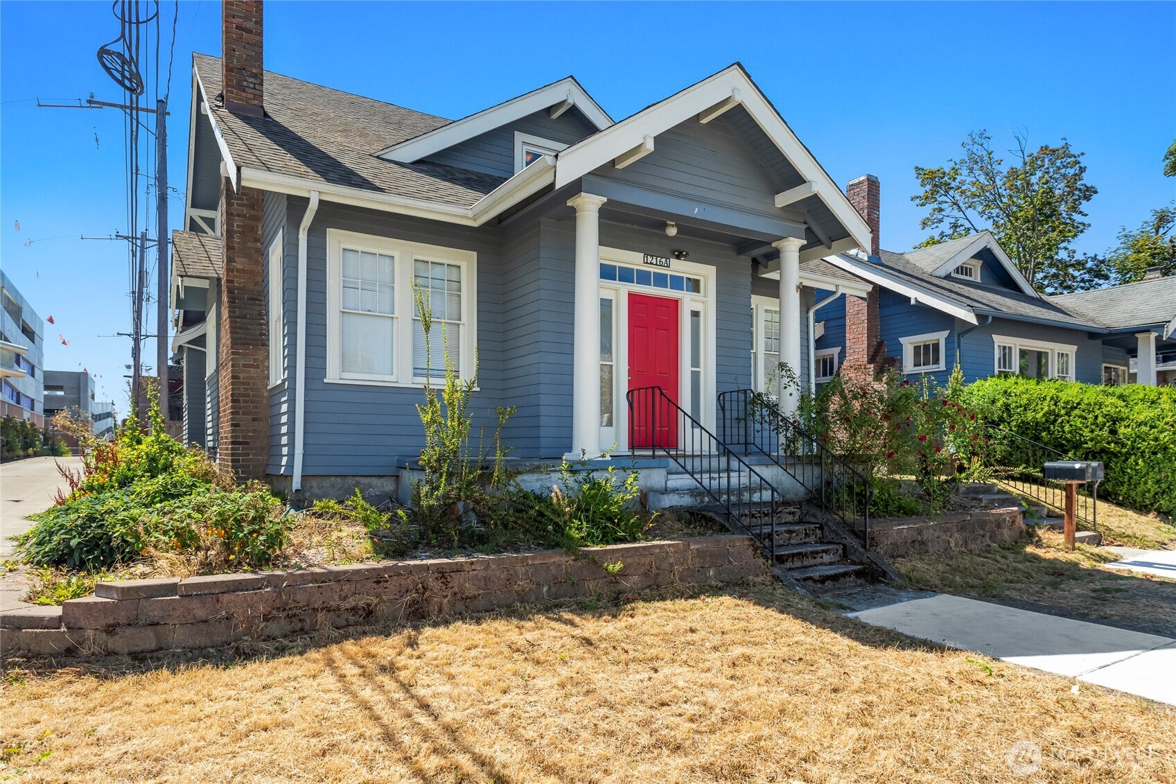 A craftsman gem built to last. Built in 1925 and beautifully updated in 2010, this move-in-ready duplex spans 2,064 finished sqft and still shows off its original hardwoods throughout, plus the comfort of a dedicated mini-split A/C in each unit. Set in Tacoma's Wedge district and direct neighbors with the Mary Bridge Children's Hospital campus, it's a location with real advantages of its own. Unit A (2 bed/1 bath, 1,384 sqft) greets you with a soaring entry and living room framed by original moldings, a dedicated dining room made for gathering, and an updated kitchen with a sunny breakfast nook. An unfinished basement with laundry adds room to spread out and store. Unit B (1 bed/1 bath, 680 sqft) lives like a light-filled loft, a fully separated bedroom, full bath, a kitchen with vaulted ceilings and a counter with bar seating, a breakfast nook, a handy walk-in pantry, a flexible living room, and it's own dedicated laundry. Two beautifully distinct homes under one classic roof. All of this within walking distance to local favorites such as Frisko Freeze and Balloon Roof Bakery. And also quick jaunt to the Stadium District as well!