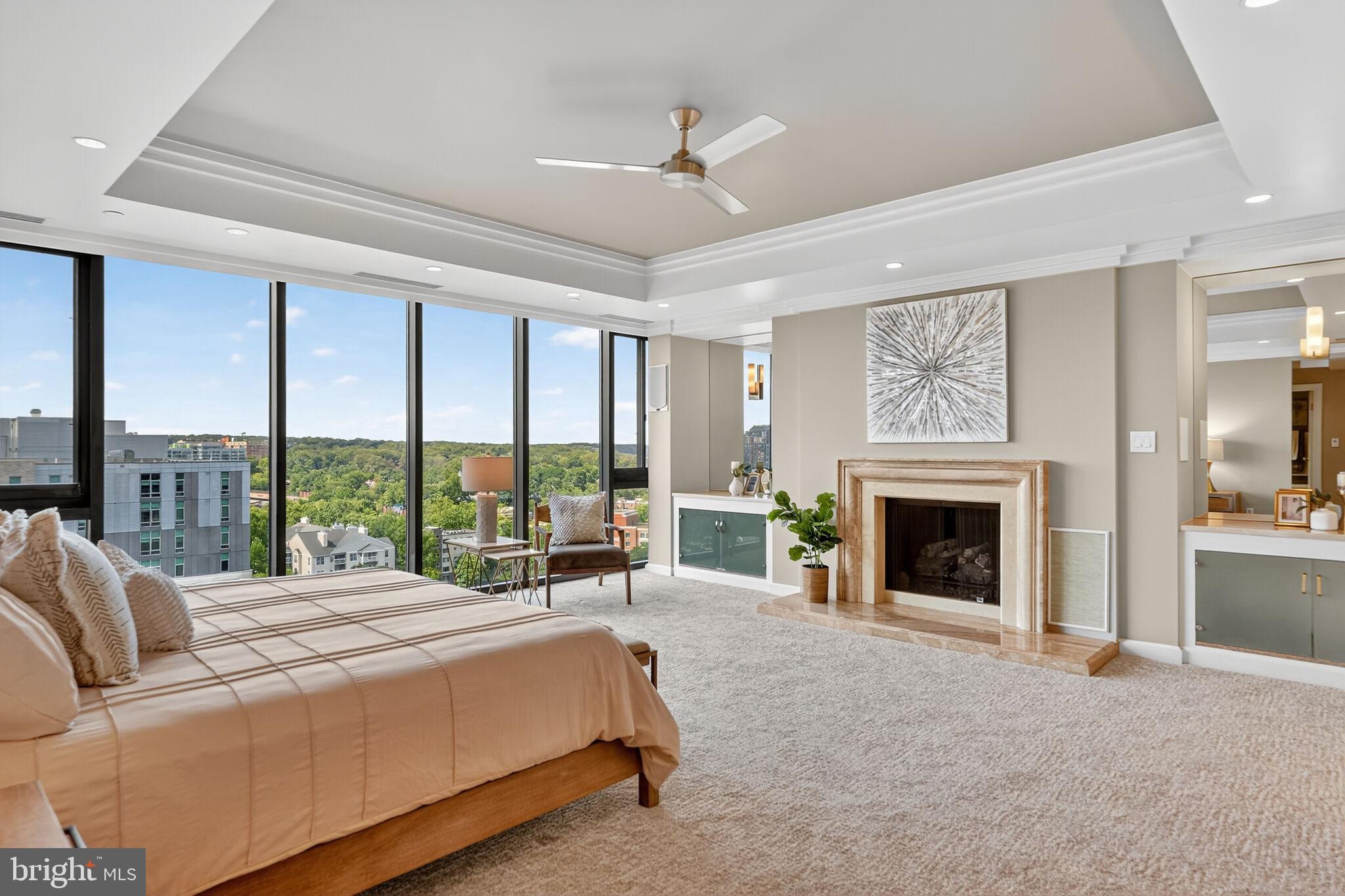 Step into timeless elegance through a grand circular foyer with a gold-painted dome, and dramatic columns. Inside, rich hardwood floors with intricate inlays, tray ceilings with cove lighting, and custom built-ins elevate every space—from the formal dining room to the living room and atrium sitting area. The recently renovated gourmet kitchen features Sub-Zero refrigerator, cooktop, a beverage fridge, expansive counters, a large island, and a breakfast bar—perfect for entertaining. The open-concept living room offers two exposures, two balconies, floor-to-ceiling windows,  fireplaces,  custom wet bar, and a Sonos sound system. A dedicated home office with custom built-ins and stunning views provides the ideal work-from-home setup.Upstairs, the luxurious primary suite includes a fireplace, HUGE oversized walk-in closets, a second closet (converted from a bedroom), wet bar, soaking tub, separate shower, and private water closet—all framed by herringbone floors with inlay borders and western exposure. Two additional bedrooms feature generous closets, ceiling fans, and floor-to-ceiling windows, along with two full baths and a full-size laundry room. Architectural details like a helical staircase with skylight, Venetian plaster, and rounded columns add sophistication throughout. Multiple balconies showcase sweeping western views, while the building’s glass-wrapped atrium and elevator create a grand, light-filled arrival. This rare offering offers luxurious space, custom finishes, and unmatched views—perfect for refined urban living or impressive entertaining. 4 Garage parking spaces!!  The amazing penthouse is PH10 & PH11 combined; The Atrium-Condo living at it's bestWalking distance to metro, bus stops, bike paths, dog park, Key Bridge and more!Next to 66, 395, Key and Roosevelt bridges, George Washington Memorial Parkway, and Lee Highway.On-staff engineers and maintenance for emergencies and repairs-Personal Storage unit (2)On-site Gym (cardio, free weights, and nautilus) with sauna and jacuzzi, Outdoor Swimming Pool, BBQ area,  Pickle Ball court, on-site dry cleaners, and Community/party room.- 4 indoor garage parking spaces, visitor parking, secure package delivery & pick up, 24-hour front desk