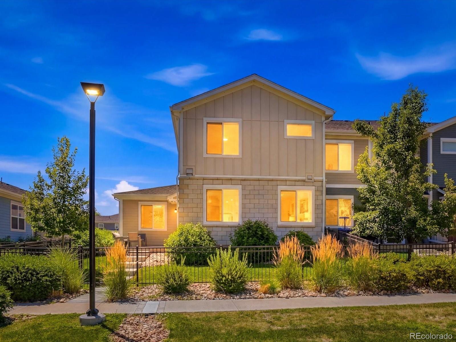 Rare 4-Bedroom Townhome in Parkes at Stonebridge. Four-bedroom townhomes in Parkes at Stonebridge rarely become available. This move-in-ready end-unit offers the space, layout, and low-maintenance lifestyle today's buyers are looking for. The open main floor is filled with natural light and features wide-plank flooring, a spacious living area, and a well-appointed kitchen with stainless steel appliances, a gas cooktop with vent hood, double ovens, built-in microwave, refrigerator, large center island, pantry, upgraded cabinetry, tile backsplash, a dedicated coffee bar, and a reverse osmosis water filtration system. Additional features include an energy-efficient tankless water heater for endless hot water and improved efficiency. A main-floor bedroom with a full bath and walk-in closet is ideal for guests, multi-generational living, or a home office. Upstairs, the primary suite includes a five-piece bath with dual vanities, a soaking tub, separate tiled shower, and 2 large walk-in closets. Two additional bedrooms, a full bath, and an upstairs laundry room complete the second level. Parkes at Stonebridge is a newer community with HOA-maintained parks, landscaped open spaces, and scenic walking paths woven throughout the neighborhood. Friendly neighborhood shops, cafes, biking and walking trails are all nearby, with quick access to Boulder. Best of all, the HOA maintains the yard, making this an easy lock-and-leave home. Located in a highly regarded school district and close to shopping, dining, and everyday conveniences, this home offers the perfect combination of space, location, and easy living.