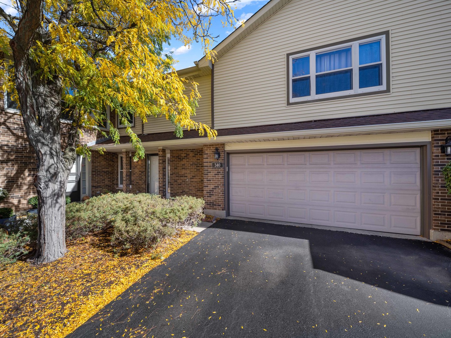 Largest Unit in the Complex - Move-In Ready!  This spacious townhome features one of the most desirable layouts in the community, perfect for even the most selective buyers. Enjoy beautiful hardwood flooring and a vaulted ceiling living room with a cozy fireplace. The updated kitchen boasts white cabinets, granite countertops, a subway tile backsplash, tile flooring, and stainless steel appliances (2022).  A bright loft overlooks the living room and can easily be converted into a third bedroom. The private first-floor den offers flexibility and could serve as a formal dining room. The large primary suite includes a ceiling fan, deluxe whirlpool tub, dual-sink vanity, separate shower, and walk-in closet. Convenient first-floor laundry adds to the home's practicality.  Completely move-in ready! Located near top-rated elementary, middle, and high schools.  Siding, gutters, and trim (2021), furnace (Dec 2021), and window blinds (Feb 2022).  Nestled on a quiet cul-de-sac with a two-car garage offering extra storage and a private cement patio-perfect for grilling or relaxing outdoors. The association allows one dog (up to 45 lbs)
