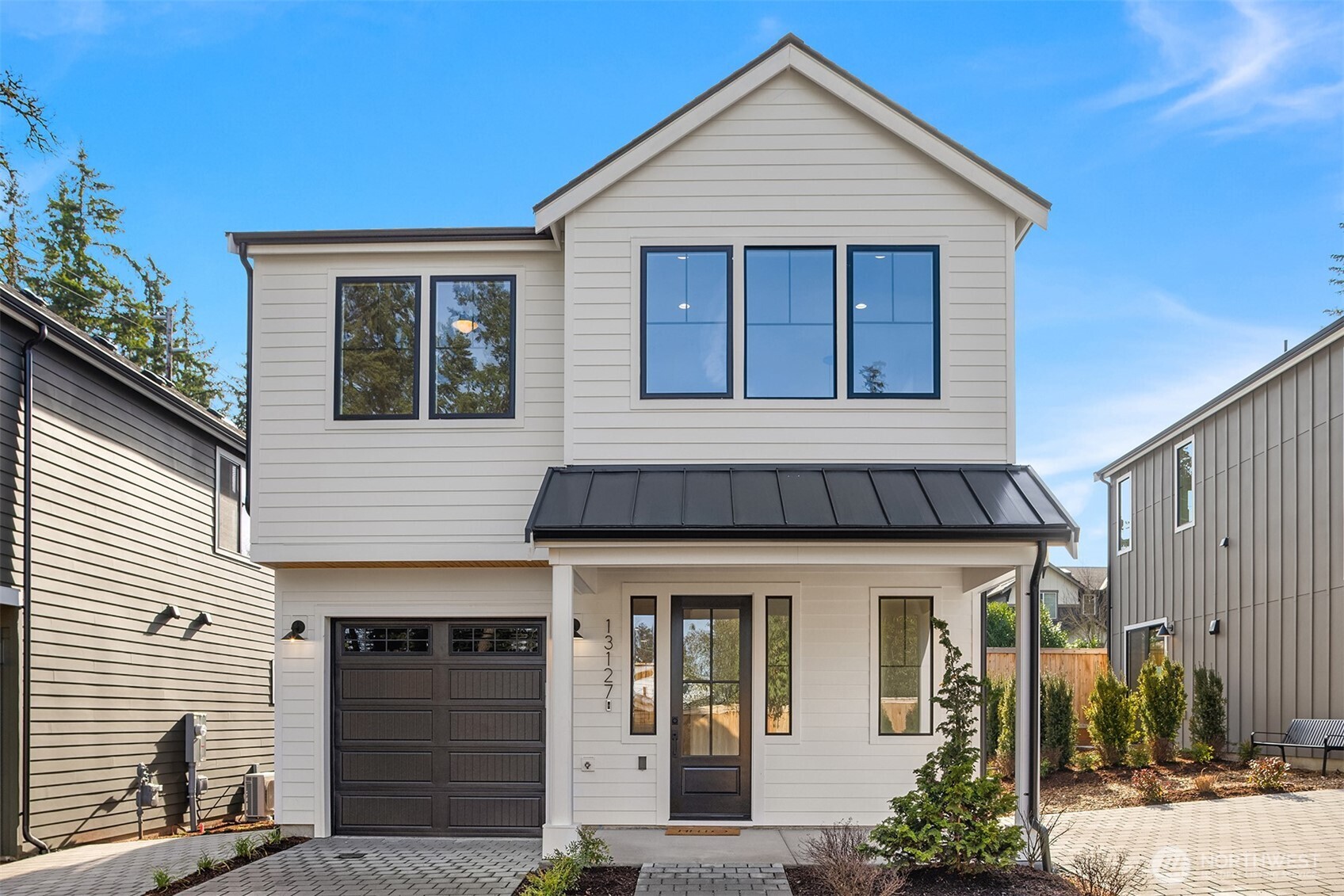 Welcome home to your new detached residence in Kirkland's North Rose Hill Neighborhood. Experience modern new construction, featuring an open layout and a well-appointed kitchen offering abundant storage and spacious island. Main level features seamless living and dining spaces plus a convenient powder room - perfect for guests. Gas fireplace with custom tile creates cozy & inviting living area. Upstairs, find a spacious primary suite with luxurious walk-in shower and dual vanity. Two additional bedrooms, full bath and office nook complete the second level. Enjoy the ease of a private garage plus additional designated parking spot. Convenient access to downtown Kirkland, I-405, and 520 make this the perfect place to call home! ** Note, home is on new private lane, use 8557 132nd Ave NE for GPS Directions**