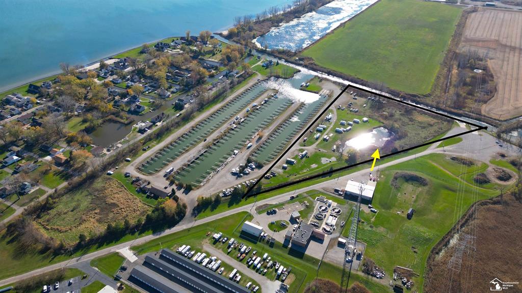 Welcome to a rare opportunity to acquire approximately 9.25 waterfront acres within the highly desirable Luna Pier Harbour Club, a well-known marina destination in Luna Pier, Michigan. Located in the Marina Overlay District, this parcel offers highly flexible and attractive zoning, creating endless possibilities for future development.  The property currently features a 25-site primitive waterfront campground, providing immediate use and income potential, with ample room for expansion or redevelopment. Whether the vision includes enhanced campground amenities, marina-supportive uses, hospitality, or mixed-use concepts, this site offers a unique blank canvas in a waterfront community where large parcels are increasingly scarce.  Ideally positioned near Lake Erie, with convenient access to I-75, Toledo, and Southeast Michigan, Luna Pier continues to attract boaters, travelers, and outdoor enthusiasts seeking a waterfront lifestyle. This offering presents a compelling opportunity to invest in a high-demand waterfront market with long-term upside.