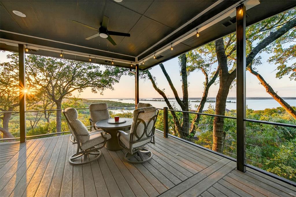 Welcome to 258 Lou Sand Hill, an exceptional move in ready opportunity perched high above the sparkling shores of Lake Texoma. This nearly 3,700-sq-ft home offers four bedrooms with three full and one half bathrooms, providing ample space for family and guests. The property is being sold fully furnished, and is turnkey ready as a rental property. Whether you’re seeking a relaxing weekend escape, a full-time residence, or a lucrative short-term rental, this retreat is ideally located in a quiet, low-traffic neighborhood. 
Experience breathtaking sunsets and uninterrupted views spanning the water and island-dotted horizon from the outdoor deck designed for entertaining or quiet moments of reflection. This peaceful half-acre sanctuary sits at the end of the road, offering privacy and tranquility year-round. 
Recent extensive updates provide peace of mind, including a new roof, water heater, and three AC units replaced within the past two years. The spacious game room and private guest suite were recently added, enhancing both comfort and entertainment options for you and your guests. 
The primary level features three spacious bedrooms and two full bathrooms, including a primary suite with a private screened deck—perfect for waking each morning to picturesque scenery. The open-concept living area flows onto a wraparound deck, seamlessly blending indoor and outdoor living. The well-appointed kitchen boasts a modern gas range and a generous walk-in pantry, all overlooking the lake. 
One guest room is thoughtfully designed with bunk beds, making it a favorite spot for kids and friends. Downstairs, guests enjoy a private suite with an efficiency kitchen, offering flexibility and privacy for extended stays. The home is easily accessible via stairs or elevator. 
Entertainment abounds in the game and media room, fully equipped with shuffleboard, pool table, projector with 120 inch screen, and more—ensuring endless fun for everyone. Experience lake living at its finest!