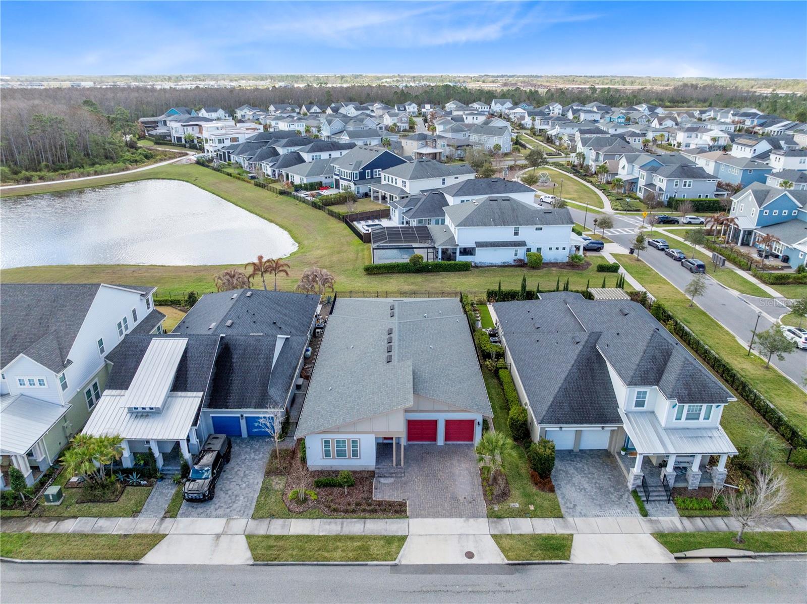 Under contract-accepting backup offers. One or more photo(s) has been virtually staged. Welcome to this rare single story Ashton Woods Nobel II model located in the highly sought after Laureate Park community of Lake Nona. Built in 2021, this home offers 2,800 square feet of beautifully designed living space with 4 bedrooms, 3 full bathrooms, a 3 car tandem garage, and a private pool overlooking peaceful water and conservation views. The home blends modern design, open living spaces, and exceptional outdoor living.The home welcomes you with a spacious gallery style foyer featuring soaring ceilings and natural light, creating an impressive first impression as you enter. Just beyond the foyer, the home opens into a bright open concept living area where the kitchen, dining space, and family room flow seamlessly together, making it ideal for everyday living and entertaining.The chef inspired kitchen serves as the centerpiece of the home and features a large center island with seating, sleek modern cabinetry, all black stainless steel appliances, and ample counter space for cooking and gathering. A walk in pantry provides generous storage, while the open layout keeps everyone connected whether hosting guests or enjoying a quiet night at home. The adjacent dining area is highlighted by a beautiful designer accent wall, adding warmth and architectural detail to the space.The primary suite is privately positioned at the rear of the home, offering a spacious retreat, plantation shutters, and plenty of room for a sitting area. The primary bathroom features a long dual sink vanity with abundant storage, a large glass enclosed shower, and a spacious walk in closet designed for easy organization.Three additional bedrooms are thoughtfully positioned throughout the home. Two of the bedrooms share a convenient Jack and Jill bathroom, while the additional bedroom is ideal for guests, a home office, or flexible living space. The layout provides privacy while still maintaining the open and connected feel that makes this floor plan so desirable.Step outside to your private backyard oasis, where the covered lanai opens to an expansive brick paver patio surrounding a beautiful custom pool with an integrated spa. The backyard overlooks a tranquil pond with conservation views beyond, offering a peaceful natural setting with no direct rear neighbors. Whether relaxing by the pool, entertaining friends, or enjoying the sunrise over the water, this outdoor space captures the best of Florida living.Located in the heart of Laureate Park in Lake Nona, residents enjoy access to the community’s exceptional amenities including the Aquatic Center, resort style pools, LP Fit fitness center, parks, playgrounds, and over 40 miles of walking and biking trails. The home is just minutes from Medical City, Nemours Hospital, the VA Medical Center, UCF College of Medicine, the USTA National Campus, Orlando International Airport, and Lake Nona Town Center dining and shopping.This is a rare opportunity to own a single story pool home with water and conservation views in one of Lake Nona’s most desirable neighborhoods.Schedule your private showing today.