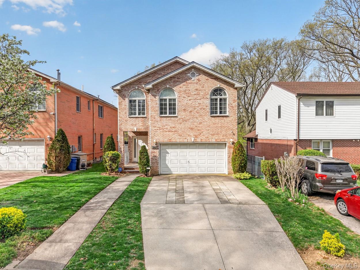 Magnificent Newly Renovated Brick Residence on a 20,016 SF Lot in Prestigious DouglastonWelcome to this beautifully renovated luxury brick home situated on an extraordinary 20,016-square-foot lot in the highly sought-after neighborhood of Douglaston. Offering 4 spacious bedrooms, 3 full bathrooms, and 1 half bathroom, this exceptional residence combines timeless craftsmanship, modern amenities, and an unparalleled outdoor lifestyle.The home's thoughtfully designed layout features a luxurious primary suite complete with a spacious walk-in closet, providing ample storage and comfort. Central air conditioning serves the first and second floors, while the fully finished basement is equipped with its own split-system HVAC unit for year-round comfort. A convenient second-floor laundry room adds practicality to everyday living.The finished basement boasts radiant heated floors, a private wine cellar, and flexible recreation space perfect for a home theater, gym, game room, or additional family living area.Set on an oversized 20,016 SF lot, the outdoor space is truly a private retreat. Step onto the expansive entertainment deck, ideal for outdoor dining and BBQ gatherings, overlooking a spectacular backyard complete with an existing hot tub/jacuzzi. The enormous yard offers endless possibilities for entertaining, recreation, gardening, or simply enjoying the privacy and tranquility rarely found in New York City.Additional features include a two-car garage and a private driveway accommodating up to four additional vehicles.Property Highlights:* Newly Renovated Brick Home* Massive 20,016 SF Lot* 4 Spacious Bedrooms* Luxurious Primary Suite with Walk-In Closet* 3 Full Bathrooms + 1 Half Bathroom* Central Air Conditioning on First & Second Floors* Split-System HVAC in Finished Basement* Radiant Heated Basement Floors* Private Wine Cellar* Convenient Second-Floor Laundry Room* Two-Car Garage* Driveway Parking for Up to Four Additional Vehicles* Expansive Entertainment Deck for Outdoor Dining & BBQs* Existing Hot Tub / Jacuzzi* Huge Private Backyard with Endless Potential* Located in the Prestigious Douglaston Community* Convenient Access to Shopping, Dining, Parks, Schools, Major Highways, and Public TransportationThis rare offering presents an opportunity to own a meticulously renovated home on one of the largest residential lots in Douglaston, delivering the perfect blend of luxury, privacy, and outdoor living.