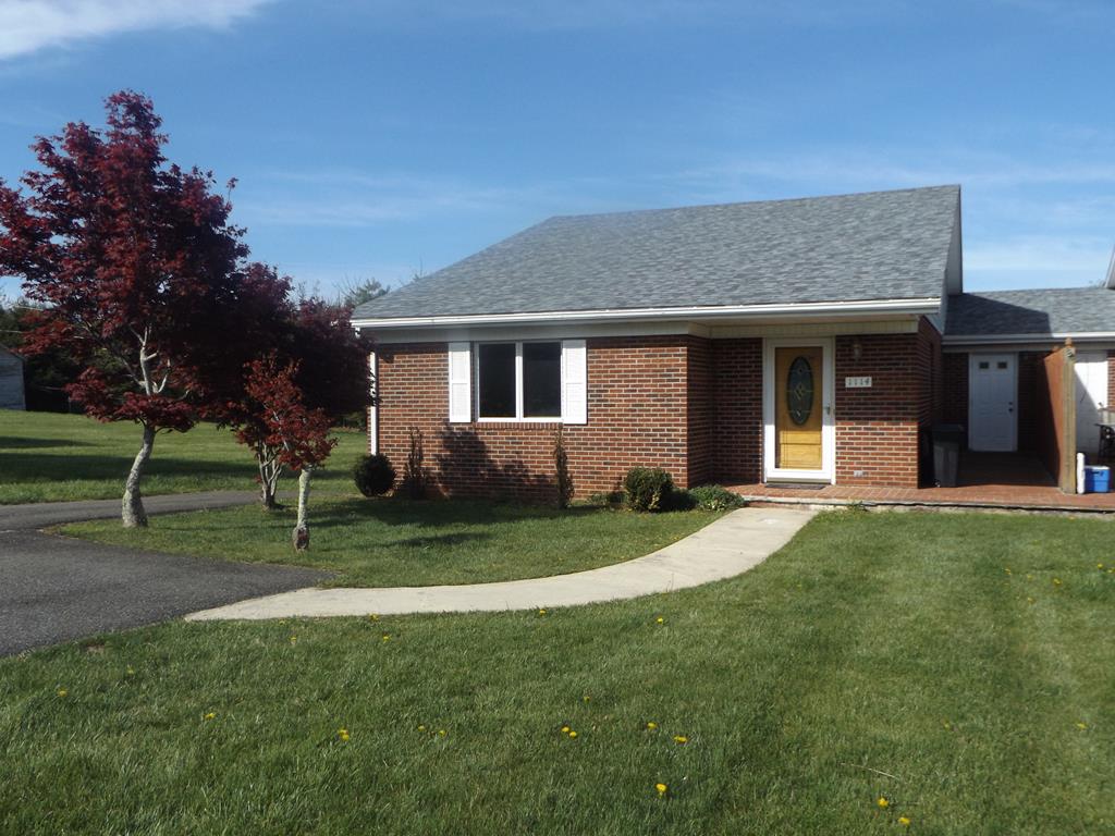 This well maintained one level 3 bedroom 2 full bath townhouse is located in a convenient quiet location in Hillsville! The home features an open floor plan with nice hardwoods in the living area and wood laminate flooring in the kitchen, dining and master suit. The kitchen lends itself to lots of room for cooking with an eat at island, lots of cabinets, all appliances and a dining area that opens to a multilevel deck for lots of fresh air and privacy! There are 2 carpeted guest rooms sharing a Jack & Jill full size bath, a large utility/storage room with washer & dryer hook ups and plenty of cabinets. Other amenities include a heat pump, maintenance free brick exterior, a paved drive, large rear deck and a covered front porch! Come take a look, it's all here for you, the closeness to shopping, schools, the Blue Ridge Parkway, and I-77!