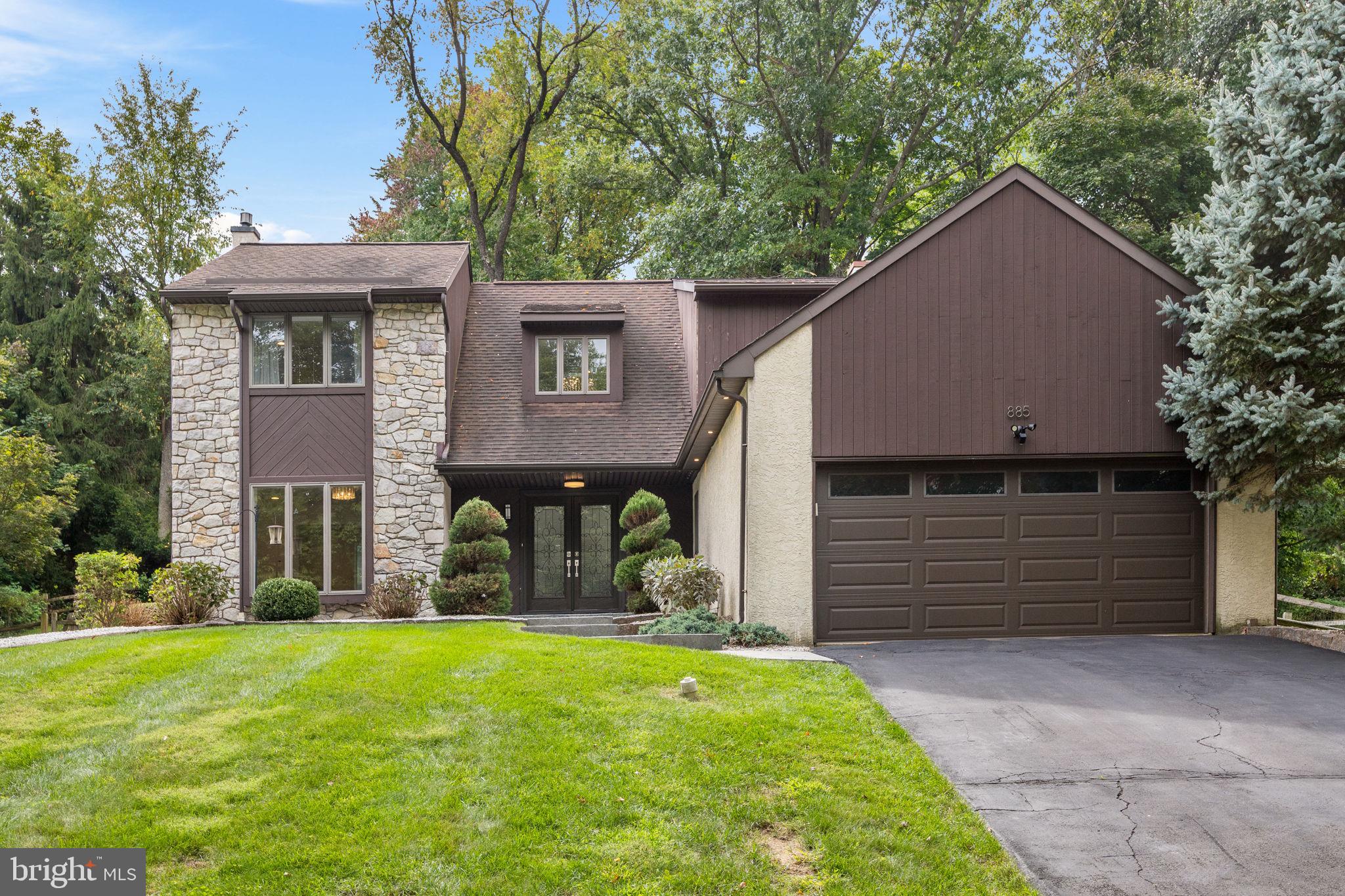 Welcome to 885 Spring View Drive, a beautifully renovated contemporary single-family home offering three bedrooms, two and a half bathrooms, a finished basement, and an expansive fenced backyard in the heart of Southampton. Perched atop a gentle hill, the home enjoys a commanding presence and exceptional curb appeal, framed by thoughtfully designed landscaping and a stamped-concrete pedestrian walkway leading to the front entrance. From the moment you enter, the home makes an impression with a dramatic two-story foyer with a massive draping chandelier, beautifully appointed staircase with iron spindles, and an abundance of natural light throughout. Hardwood flooring flows across the main living areas, creating a seamless and sophisticated feel. To the left of the foyer is a spacious living room, while the opposite side offers a thoughtfully designed built-in storage area, laundry room, and convenient access to the garage. Continue into the inviting family room, highlighted by a striking stacked-stone feature wall, fireplace, and custom built-ins. The heart of the home is the completely updated kitchen, featuring crisp white cabinetry, an oversized quartz center island with waterfall edge, stainless steel appliances, built-in microwave, and ample workspace and storage. An adjacent breakfast area is surrounded by a beautiful bay window, creating a bright and comfortable setting for everyday dining. A separate dining area provides additional space for entertaining and special occasions. Upstairs, you will find three generously sized bedrooms and a beautifully appointed hall bathroom featuring a double floating vanity and tub/shower combination. The primary suite is a true retreat, offering plenty of space for a king-size bedroom set, an impressive walk-in closet with custom built-ins, and a recently renovated en-suite bathroom finished with designer tile, a marble top double vanity and a frameless glass shower with built-in bench, niche and rain shower head. The finished lower level provides additional flexible living space ideal for a media room, recreation area, home office, fitness space, or playroom. Outside, the large fenced backyard offers exceptional space for outdoor enjoyment and is complemented by an expansive stamped-concrete patio ideal for dining, entertaining, and summer gatherings. Conveniently located near Churchville Nature Center, local parks and trails, and just minutes from the shopping, dining, and amenities of Richboro and Newtown. The property is also located within the Centennial School District and is convenient to William Tennent High School and Davis Elementary School. Thoughtfully renovated, beautifully maintained, and designed for both comfortable everyday living and entertaining, 885 Spring View Drive is a home that truly stands out. Schedule your private showing today.