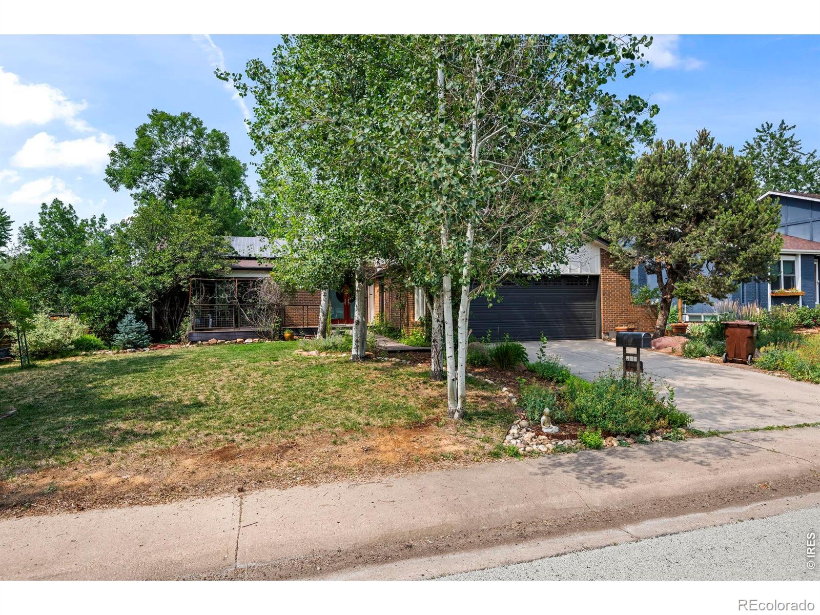 Beautifully updated & thoughtfully modernized, this exceptional home sits on a private lot in highly sought-after Arapahoe Ridge. Offering 4BR, 4BA & 3,062 sq ft, the home showcases quality craftsmanship, timeless finishes, and outstanding upgrades throughout. Hardwood floors, newer windows, surround sound & an open floor plan create inviting spaces for everyday living & entertaining. The beautifully appointed kitchen features cherry cabinetry, granite slab & premium Bosch stainless appliances, including an 800 Series refrigerator, induction range and oven, and Bosch 500 Series dishwasher, all replaced within the past five years. The expansive primary suite is a true retreat w a spa-inspired bath featuring heated floors, a two-person infrared sauna, soaking tub, and custom walk-in shower w body jets, rain shower & handheld spray wand. Updated bathrooms throughout add to the home's move-in-ready appeal, while the oversized second upstairs bedroom could easily be converted into a 3rd upper-level BR if desired. The finished basement offers exceptional flexibility w a spacious recreation room, full wet bar w refrigerator, additional BR & BA, plus a dedicated media room featuring an Atmos-ready 9.1 in-wall Definitive Technology speaker system for an immersive home theater experience. Step outside to a large private backyard w an expansive covered Trex deck, creating the perfect setting for outdoor dining, entertaining, or relaxing. Designed for efficiency & innovation, the home includes a 16.2 kW SolarEdge solar system with 45 panels, newer inverters, and a Sense energy monitoring system. A Tesla Wall Connector provides fast EV charging, while Tesla PowerShare capability allows a compatible vehicle to serve as whole-home backup power during outages. Newer major mechanical systems provide additional peace of mind. An exceptional opportunity to own a truly special home in one of Boulder's most desirable neighborhoods, close to parks, trails, shopping & top-rated schools.