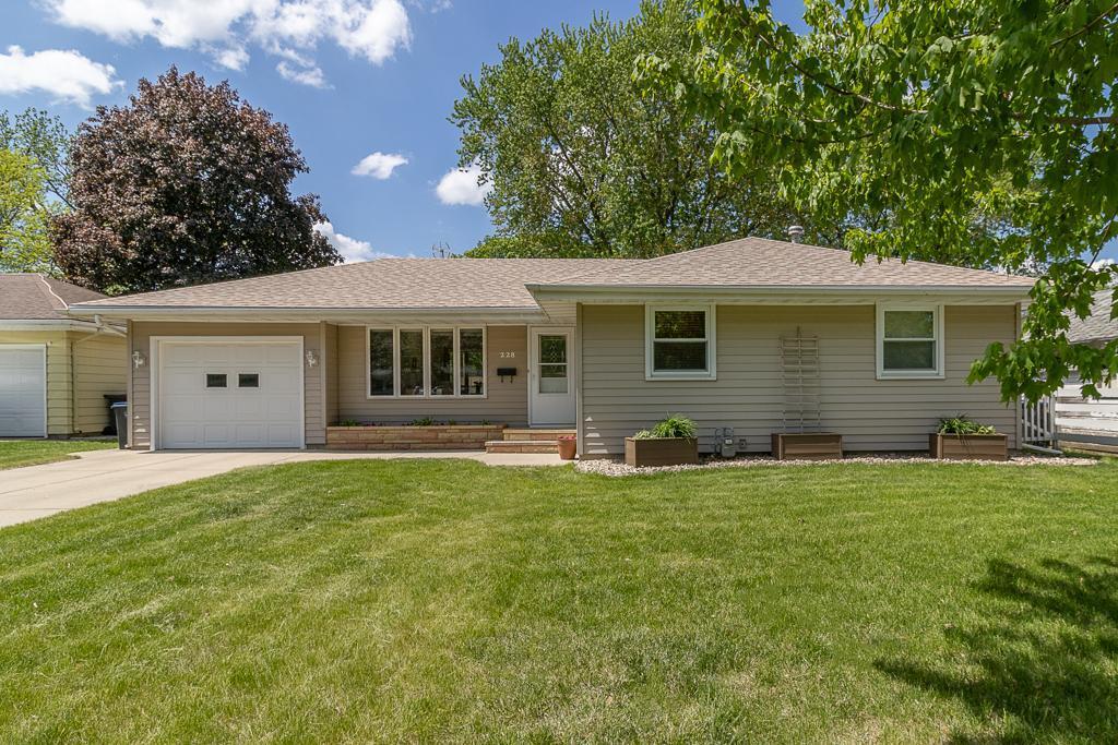 Welcome to 228 Meray Boulevard—a thoughtfully updated and extremely well-maintained one-story home offering 3 bedrooms, 2 bathrooms, and over 1,700 finished square feet of living space. From the moment you arrive, you’ll notice the charming Kasota stone planter at the front entry—perfect for flowers or seasonal decor. Step inside to discover gleaming hardwood floors on the main level and lots of charm throughout. The remodeled kitchen is both stylish and functional, featuring Quartz countertops, a tile backsplash, built-in china cabinet, and double kitchen sink windows offering peaceful backyard views and lots of natural light. There's also an informal dining area and easy access to the backyard patio. All three bedrooms are conveniently located on the main level, along with an updated full bath with onyx countertops 
and main-floor laundry. Downstairs, you'll find even more living space with durable LVP flooring, a spacious family/rec room, a second laundry area complete with a shower, and a large utility/storage room that can easily accommodate a home gym, office, or craft space. Outside, enjoy a partially fenced yard filled with established perennials, a brand-new garden shed, and plenty of room to relax or garden. This home is truly move-in ready—well-cared for, inviting, and full of features that you will appreciate!