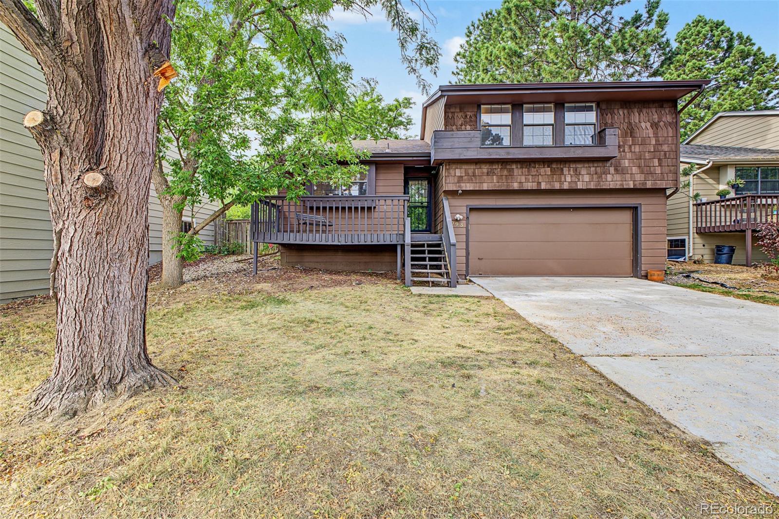 Tucked away on a quiet cul-de-sac in the highly sought-after Ridge at Foxridge neighborhood, this multi-level home offers exceptional potential and an unbeatable Centennial location within the acclaimed Cherry Creek School District. The home is ready for its next owner to bring their vision and make it their own, with opportunities for cosmetic updates throughout. The main level welcomes you with vaulted ceilings and natural light. The kitchen offers plenty of cabinetry and counter space and overlooks the comfortable lower-level family room. While functional as it stands, the kitchen is dated and provides an excellent opportunity to redesign and update the space to fit today's style and preferences. The family room features a cozy fireplace and direct walkout access to the private, mature backyard. Upstairs, the primary retreat features an en-suite bath and ample closet storage, accompanied by spacious secondary bedrooms and a full guest bath. The lower level features nice living room with fireplace and a fourth bedroom/office and bathroom.The unfinished basement offers additional potential for future living space, a home gym, spacious laundry room, workshop, or abundant storage. Enjoy the peaceful neighborhood setting with convenient access to walking trails, local parks, neighborhood swim and tennis facilities, and Cherry Creek schools, including Dry Creek Elementary, West Middle, and Cherry Creek High. Centrally positioned near the Denver Tech Center, Park Meadows, I-25, and C-470, this home is a great opportunity for a buyer looking to build equity through updates and create a home tailored to their own style in one of Centennial's established and beautiful communities.