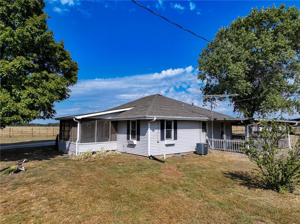This 2-bedroom, 2-bathroom home in Osceola, Missouri, is worth a look! Built in 1970, this 1,444-square-foot home sits on 6.4+/- acres and offers plenty of space to enjoy the outdoors. The property features a fenced yard, a covered porch to sit and enjoy your morning coffee, and a large barn/shed for storing equipment, working on projects, or creating your own hobby farm setup. With room for a garden, chickens, small livestock, or other homesteading ideas, there are plenty of opportunities to make this property your own. The home is serviced by a private well and septic system and has central heating and cooling for year-round comfort. Highway frontage provides easy access to and from the property.Located in St. Clair County, Osceola is a small Missouri town with a laid-back atmosphere and a strong connection to the outdoors. You'll find local shops, restaurants, schools, and everyday conveniences in town, while Truman Lake and the surrounding countryside offer plenty of opportunities for fishing, hunting, boating, and exploring. Whether you're looking for a place to call home, a small hobby farm, or a little acreage to grow a garden and enjoy the country life, this property offers the space and potential to make it happen.