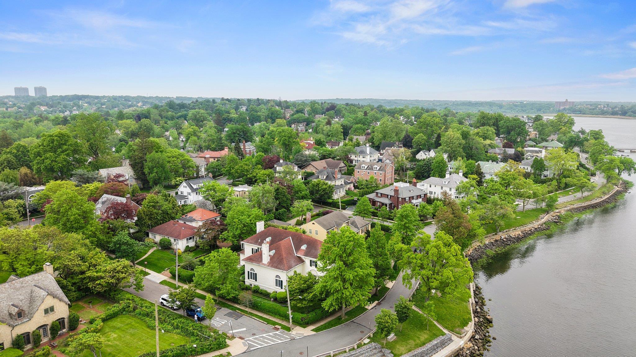 Timeless Waterfront Luxury At 1008 Shore Road In The Prestigious Douglaston Manor. This Waterfront Mansion Spans Over 6,000 Square Feet, Offering A Blend Of Elegance And Comfort. Step Into An Oversized Living Room With Soaring 20-Foot Ceilings And A Cozy Gas Fireplace. Bask In Natural Light From The Sun-Filled Sunroom. The Home Boasts Four Large Bedrooms, A Nearly 2,000-Square-Foot Basement, A Spacious Formal Dining Room, A Butler's Pantry, And An Eat-In Kitchen. Enjoy The Convenience Of A Two-Car Garage And Revel In The Beautiful Views Through Expansive Windows That Bathe The Home In Sunlight. Taxes Never Grived