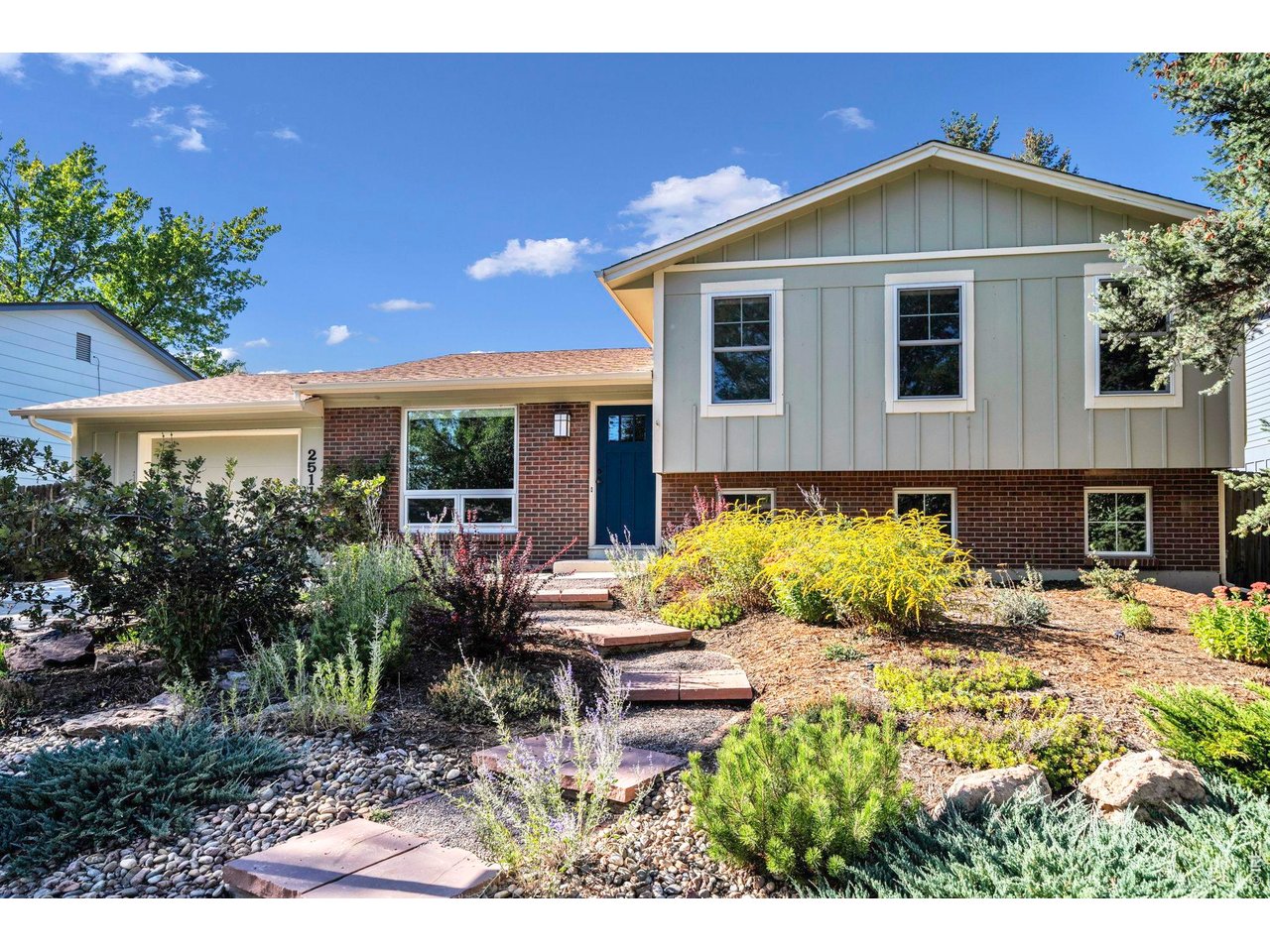 Enjoy the rare opportunity to back directly to Callahan Open Space in a quiet Louisville neighborhood, with year-round views toward Rocky Mountain National Park and direct access to the Louisville Powerline Loop Trail. Set in a peaceful, low-traffic neighborhood near Keith Helart Park, this home features more than $100,000 in thoughtful, quality improvements - Pella windows, newer roof and gutters, updated HVAC, newer water heater, fresh interior & exterior paint, new hardwood flooring throughout the main level, and extensive landscaping. Abundant natural light fills the home, while gorgeous hardwood floors create a warm, cohesive feel. The kitchen features rich wood cabinetry, granite countertops, a newer GE Profile induction range, Bosch dishwasher & new stainless refrigerator. An adjoining breakfast nook opens to a spacious covered patio overlooking the expansive backyard and uninterrupted open-space views. Upstairs, the generous primary suite features a shared 3/4 bath, with newer carpet throughout the upper level that also has 2 additional bedrooms. The lower level offers flexible living space with LVT flooring, a large family room with a cozy fireplace, fourth bedroom, and completely remodeled 3/4 bath/laundry room. Other improvements - Daikin two-stage furnace and AC, updated sewer line to the street, and an updated main electrical panel with a dedicated 50-amp circuit for EV charging. The oversized garage provides plenty of storage for outdoor gear, plus 2 car driveway. Outside, the oversized backyard is a serene retreat with updated landscaping, sprinkler & drip irrigation, and newer fencing. With protected open space directly behind the home, you'll enjoy expansive views, incredible sunsets and miles of trail access. Just minutes from Old Town Louisville's award-winning restaurants and shops, along with top-rated Boulder Valley schools, this home offers an exceptional combination of extensive updates, an incredible setting and the Louisville lifestyle.