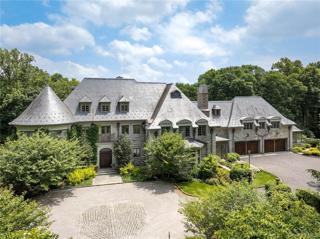 This spectacular limestone French Manor estate sits on 10+ acres on Converse Lake with 100'+ of lakefront in exclusive Conyers Farm, a guard gated community with private security. Custom designed for the current owners by architect James Davis, this meticulous home features impressive attention to detail. The main & garden level of the home are ideal for entertaining with an oversized great room, music room, formal living and dining room with double-sided fireplace. Many rooms open onto the terraces overlooking the lake and pool. The master bedroom suite is comprised of 3 rooms; sleeping room, sitting room with a balcony and luxurious onyx bath. The four finished floors of living space feature 8 bedrooms, 11 full baths, 2 powder rooms, a full gym, indoor half basketball court with NBA 3-point line, a steam room, home theatre and every modern amenity. The grounds include a heated pool & spa, golf green & playground. There is a separate pool kitchen with dining area and changing rooms. Additional Information:  Amenities:Dressing Area,Marble Bath,Soaking Tub,Storage,HeatingFuel:Oil Above Ground,ParkingFeatures: 4+ Car Attached,