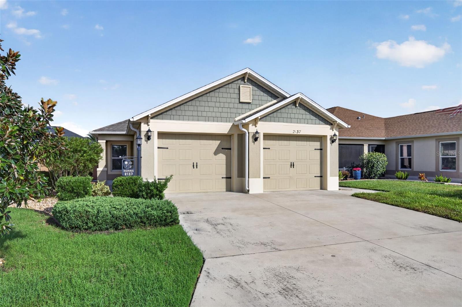 Welcome to 2137 Lockin Lane, a beautifully maintained 3-bedroom, 2-bath courtyard villa located in the desirable Village of McClure in The Villages! Built in 2018 and offering 1,484 square feet, this home is being sold TURNKEY and includes a Yamaha golf cart, making it easy to start enjoying The Villages lifestyle from day one.Step inside to a bright, open floor plan featuring tile flooring throughout—NO CARPET! The kitchen is equipped with stainless steel Whirlpool appliances, a gas range perfect for the home chef, ample cabinetry and plenty of workspace for entertaining. A Whirlpool washer and dryer are also included.The spacious primary suite features a tray ceiling, large walk-in closet and an impressive ensuite bath with dual vanities and a large walk-in shower. The guest bath offers a convenient tub/shower combination along with plenty of storage. Two additional bedrooms provide flexibility for overnight guests, a home office or hobby space.The courtyard-villa design provides the privacy and low-maintenance lifestyle so many buyers are looking for, while the garage features two garage doors for convenient access and storage. Perfect for DOG OWNERS!!And the location is fantastic! You’re just minutes from Magnolia Plaza, with Publix, Foxtail Coffee and additional shopping and dining, as well as the Loblolly and Longleaf Executive Golf Courses. Enjoy easy golf-cart access to some of the area’s most popular destinations—approximately 12 minutes to Sawgrass Grove, 12 minutes to Eastport and 15 minutes to Brownwood Paddock Square.TURNKEY, GOLF CART INCLUDED, NO CARPET, GAS COOKING and a terrific Village of McClure location! Whether you’re looking for a full-time residence or your Florida getaway, this villa is ready for you to move in and start enjoying everything The Villages has to offer.