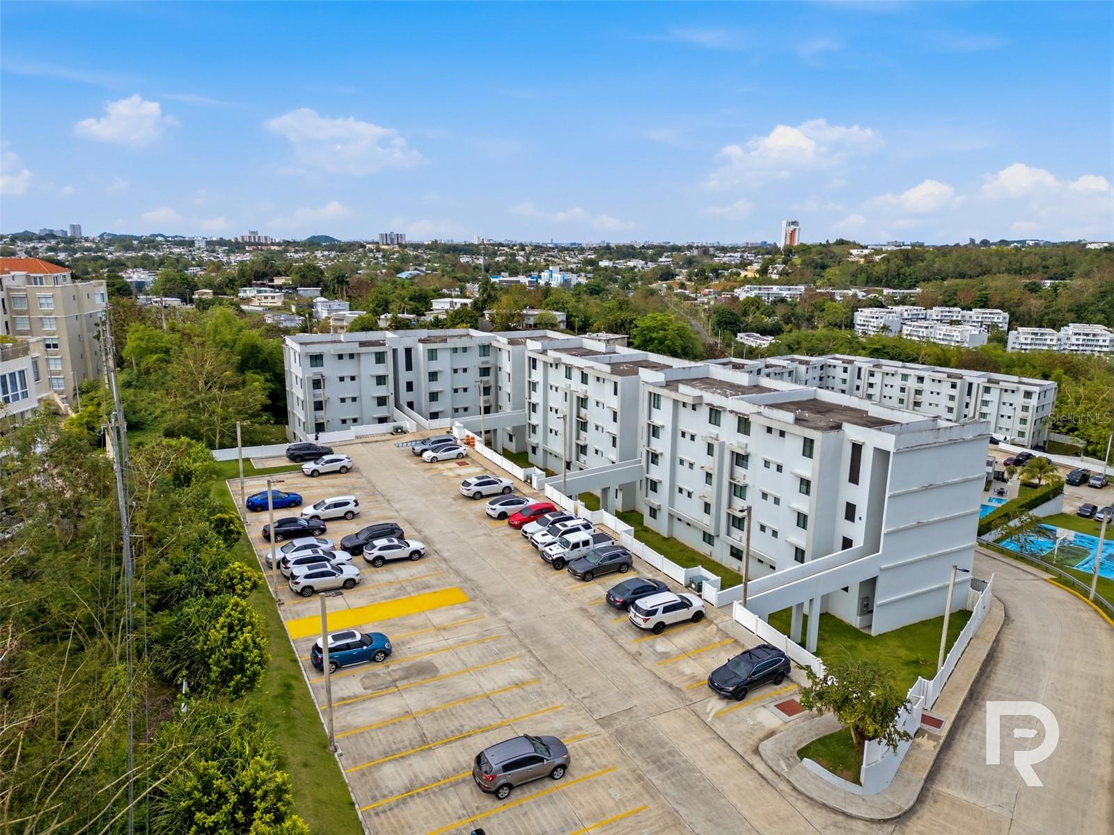 One or more photo(s) has been virtually staged. Sitting at the highest point of the building, this top-floor apartment in Laderas de Guaynabo offers something that's genuinely hard to come by — the best views in the complex, real cross ventilation, and the kind of natural light that makes a space feel completely different from the units below.The apartment has three bedrooms, two full bathrooms, and two side-by-side parking spaces. The high ceilings add to the already open feel of the unit, giving every room more air and volume than you'd expect.The building itself holds up its end of the deal too. Amenities include a pool, basketball court, a fully equipped gym, and a event room available for private use — plus 24/7 secured access, so the building feels as good to come home to as the apartment itself.Location-wise, Laderas de Guaynabo is about as central as it gets — major highways, schools, restaurants, and shopping are all just a few minutes away, but you don't feel like you're on top of any of it.If you've been looking in this area for a while, you know units like this don't come up often.