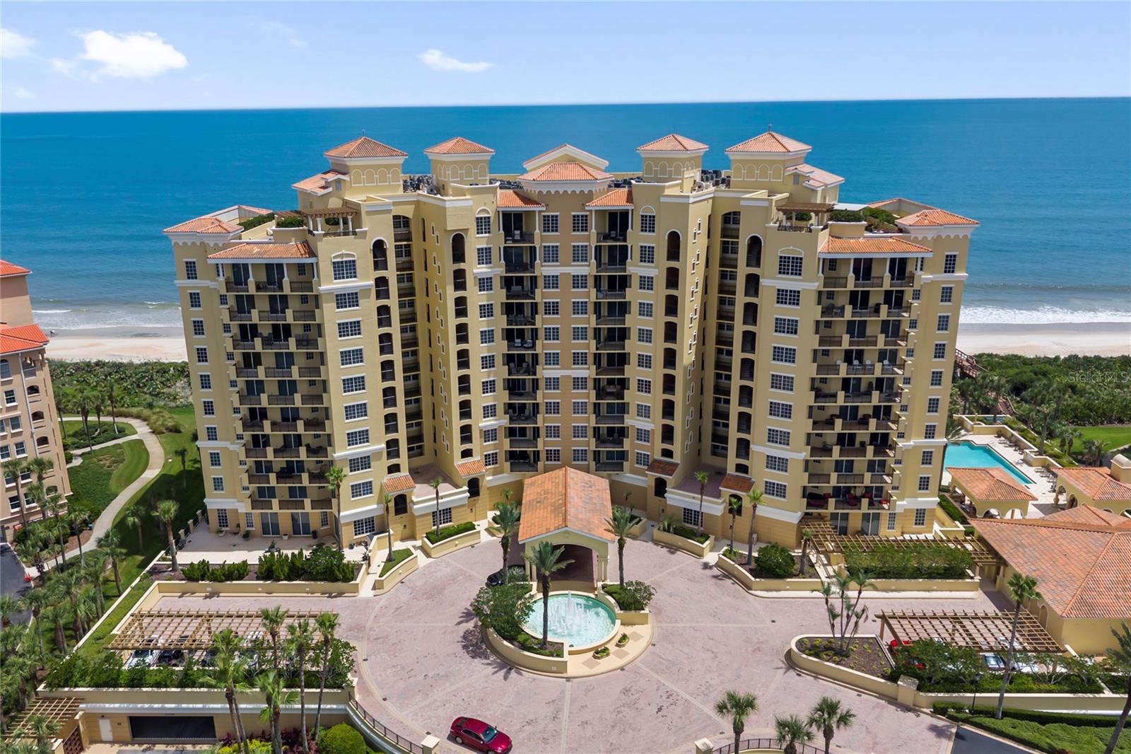 Experience exceptional direct oceanfront living from this beautifully appointed residence in one of the most sought-after oceanfront buildings in Hammock Dunes. Offering 2 bedrooms, 2.5 baths, and 2,340 square feet of spacious living, Unit 305 is designed to embrace its spectacular Atlantic setting with expansive windows, abundant natural light, and beautiful ocean views throughout the main living areas. The open-concept living and dining spaces flow effortlessly together and extend to an expansive covered oceanfront balcony, creating an ideal setting for relaxing, entertaining, and enjoying refreshing coastal breezes. The spacious kitchen is beautifully appointed with rich wood cabinetry, granite countertops, stainless steel appliances, generous preparation and storage space, and a large breakfast bar overlooking the living areas. The serene primary suite captures stunning ocean views and features direct balcony access, a sitting area, and a spacious bath with dual vanities, a soaking tub, separate shower, and dedicated vanity area. The well-appointed guest suite provides a comfortable and private retreat, while the additional half bath is conveniently positioned for guests. A private elevator entry opens directly into the residence’s exclusive vestibule, providing an enhanced sense of privacy and an elegant arrival experience. To further elevate the Hammock Dunes lifestyle, membership to the Hammock Dunes Club is available, offering an exceptional member experience with an oceanfront clubhouse, a “Low Country” clubhouse with formal and casual dining, two Audubon-certified golf courses by Tom Fazio and Rees Jones, a 5,000 sq ft ocean-view fitness center, oceanfront pool complex, playground, splash pad, tennis, pickleball, croquet, bocce, and more.