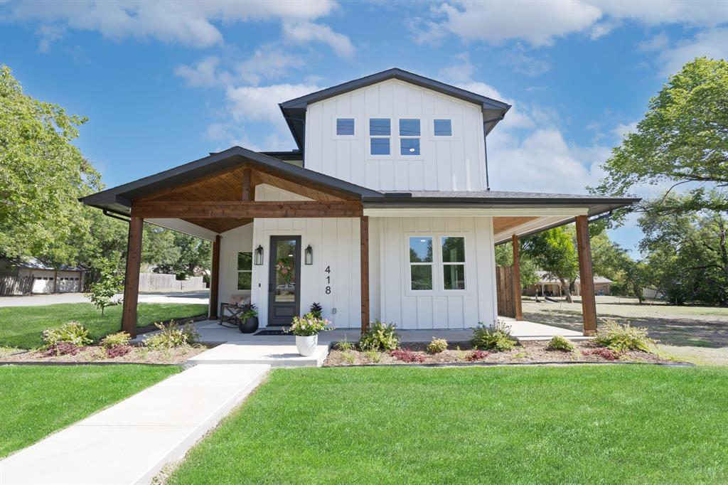 Welcome to this Beautiful 4 Bedroom, 3 Bath Custom Home which blends timeless charm with thoughtful craftsmanship. Just a short stroll to local dining and shopping, this home offers the warmth of small town living withthe comfort of modern design. Inside, a Soft Neutral Designer Palette complements Solid Hardwood Flooring and a Spacious Layout with an Abundance Of Storage Space. The kitchen has an Oversized Island with Fully Extendable Soft Close Drawers and Deep Cabinets, Quartz Countertops, a Hidden Walk-In Pantry and a Premium KitchenAid Appliance Package including the Refrigerator. This home offers an array of premium finishes and hidden upgrades. Every detail has been carefully planned and considered.  Come experience the charm of Downtown Justin, reimagined with modern luxury!Please see the Notable Features List in Transaction Desk.