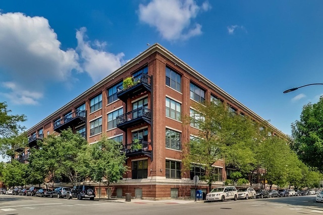 Welcome to Unit 203 in one of the West Loop's most iconic and sought-after loft buildings. This rarely available second-floor residence offers the perfect blend of warmth, industrial character, and custom designer upgrades. Soaring 12-foot timber ceilings, exposed brick and beams, and a dramatic wall of windows overlook professionally landscaped courtyard gardens, creating a peaceful urban retreat.    A generously sized private terrace extends your living space and is ideal for relaxing or entertaining. Inside, you'll find hardwood floors throughout, a stainless steel and granite kitchen, and a beautifully renovated bathroom featuring sleek Italian tile, a modern vanity, and updated fixtures. The bedroom offers 3/4-height walls for an open loft-style feel and includes a walk-in closet professionally built out by Closets by Design for maximum organization. A bonus flex space with a floating desk adds functionality and leads to a second large closet, also custom-designed by Closets by Design. Additional features include custom Hunter Douglas window treatments and a Bose surround sound system.    Deeded heated garage parking is available for an additional $30,000, and a private storage unit is included. This full-amenity building features 24-hour door staff, a yoga studio with classes offered, a fitness center, business center, movie theater room, party room, on-site management and maintenance, and a free guest parking lot. All of this is set in a premier West Loop location just steps to Mary Bartelme Park, Fulton Market, Randolph Street's restaurant row, and with easy access to the Loop and expressways.