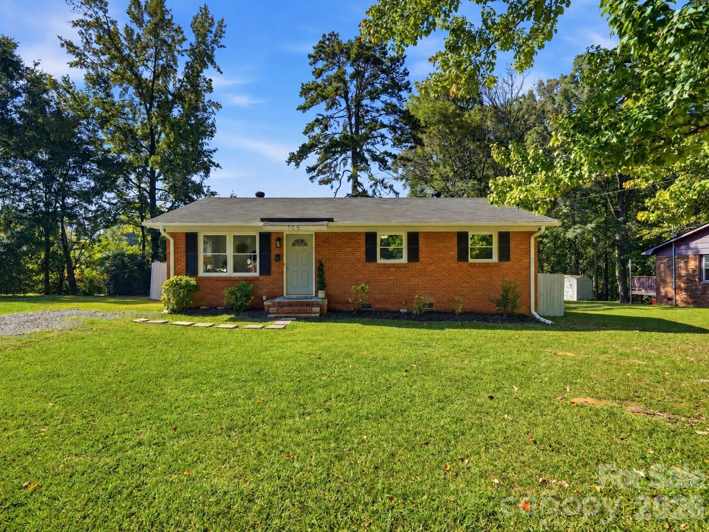 This isn't your typical renovated ranch! This full brick, one story home in Fort Mill offers 3 bedrooms, 2 full baths and extensive renovations that go far beyond cosmetic updates. Inside, you'll find all-new flooring, fresh paint, custom trim, board and batten accents, updated lighting and a completely remodeled kitchen with new cabinetry, quartz countertops, stainless steel appliances and custom shelving. Both bathrooms have been fully renovated with quartz countertops, marble shower surrounds and new fixtures. The improvements go well beyond appearances with ALL NEW plumbing, electrical wiring and panels, windows, HVAC ductwork, and crawl space insulation and vapor barrier. Additional updates include new interior doors, custom primary suite ceilings and exterior paint. Enjoy a fenced backyard, mature trees and a lot just over a quarter acre. Located in the Fort Mill School District, this home brings together classic brick charm with major system updates for move in ready living! Plus, a transferable termite bond and a one year warranty are included for added peace of mind.