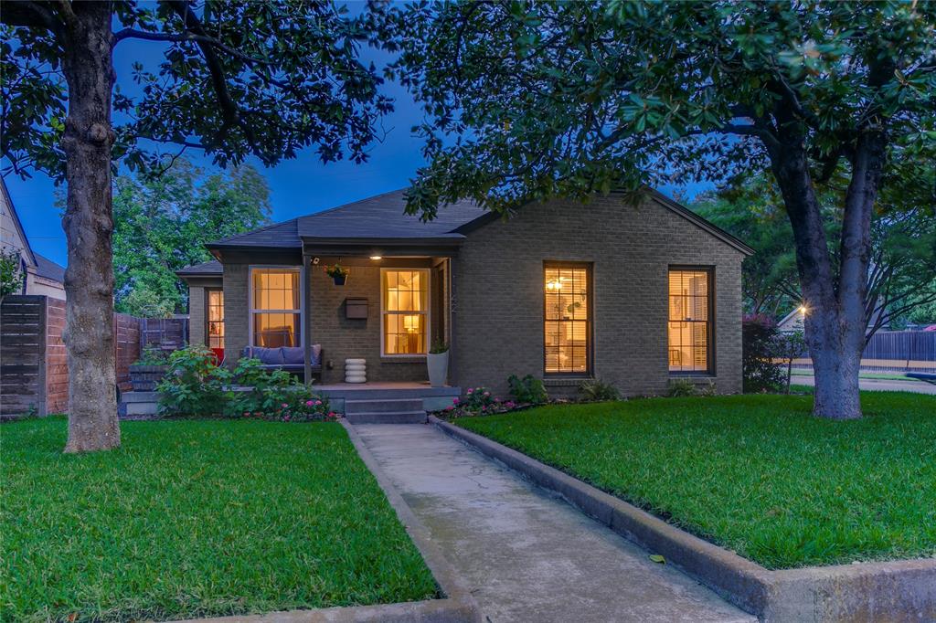 Tucked onto a beautifully landscaped corner lot, this thoughtfully updated bungalow feels like a small world of its own. Mature trees stretch overhead, café lights glow at dusk, and every space has been designed with both beauty and livability in mind.The 3-bedroom, 2-bathroom home spans 1,546 square feet, with interiors that strike a rare balance between charm and clean modern design. Hardwood floors run throughout the main living spaces, while oversized windows flood the home with natural light and create an easy flow from room to room. The kitchen blends timeless materials with everyday function, featuring Carrara marble countertops, subway tile backsplash, stainless steel appliances, and generous prep space.Each bathroom carries its own personality, mixing vintage-inspired details with updated finishes in a way that feels collected rather than overly polished. The detached bonus room adds flexibility for work, fitness, creative projects, or a second living area, while the large workshop and detached two-car garage offer space rarely found in homes of this size.But it’s the backyard that stays with you. Professionally designed and intentionally layered, the outdoor spaces unfold into a series of inviting moments: a fire pit beneath glowing string lights, quiet garden seating tucked behind climbing vines, long dinners under the trees, and winding pathways that make the entire property feel connected and calm.A home that feels design-forward yet deeply welcoming, with a character all its own.