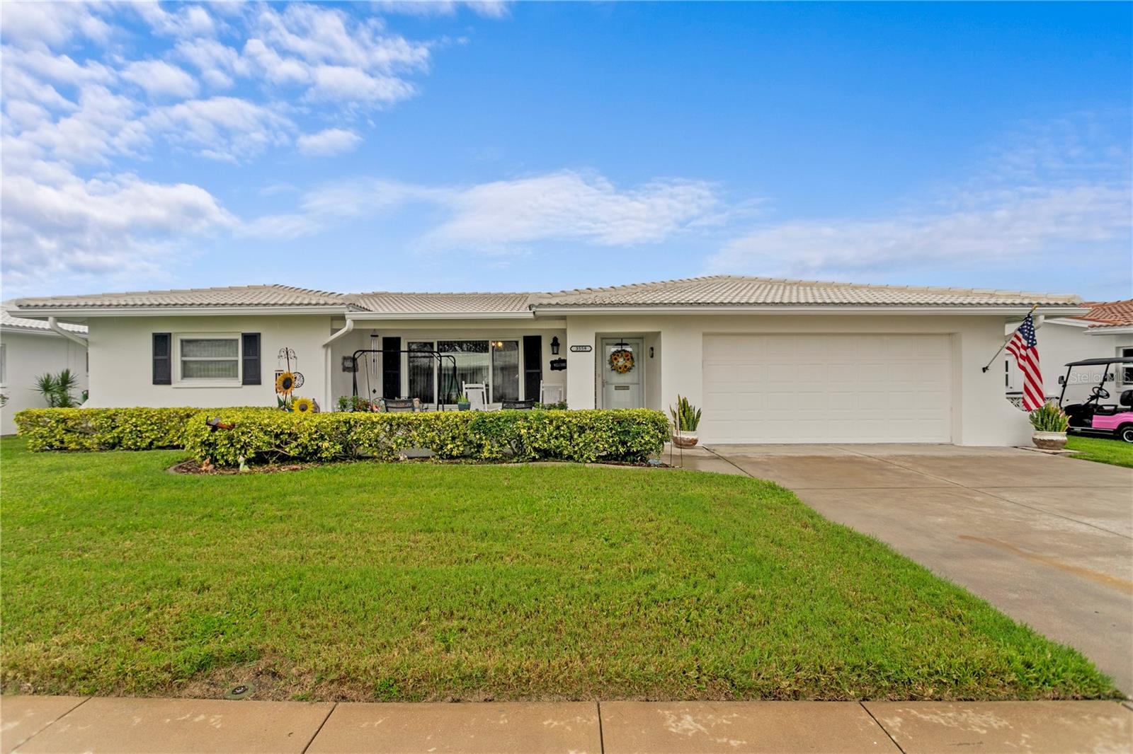 Welcome to this beautifully maintained 2-bedroom, 2-bath home with an oversized 2-car garage and extended driveway, offering over 1,700 sq. ft. of living space. This is one of the few homes in the neighborhood with such a generous floor plan, and it’s loaded with upgrades.

Enjoy your mornings on the 20x11 covered front porch or relax in the brand-new 12x12 screened back porch, perfect for taking in the Florida lifestyle while visiting with neighbors cruising by on their golf carts. Inside, you’ll be greeted with wood-look tile flooring throughout, and the highly desirable Eden floor plan featuring a large living room, two dining areas, and a 30x12 Florida room—ideal for entertaining family and friends.

The updated kitchen includes granite countertops, backsplash, modern faucet, and newer stainless steel appliances. The spacious primary suite boasts an upgraded bathroom and a large walk-in closet. The guest bedroom is equally roomy, with two oversized closets, and the updated guest bath offers comfort for visiting friends and family.

Peace of mind comes with newer hurricane impact windows, a 2023 roof, 2022 water heater, 2018 AC, updated outlets & switches, and attic storage with pull-down stairs.

Mainlands of Tamarac by the Gulf is a vibrant 55+ community surrounded by a golf course and offering endless activities, including seven clubhouses, pools, and shuffleboard courts. The Unit 4 clubhouse is within walking distance and features a large heated pool and plenty of social events. The HOA makes life easy, covering roof replacement and repair, cable, internet, water, sewer, garbage, irrigation, lawn care, and exterior paint.

Centrally located in Pinellas County, you’re close to both Tampa & St. Pete airports, award-winning beaches (10–12 miles away), shopping, dining, and entertainment.

And the best part—this home did NOT flood!

If you’re ready to retire or looking for the perfect second home, this one is a must-see. Schedule your private tour today!