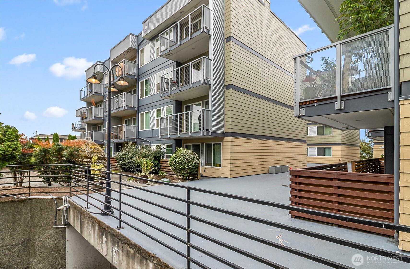 Discover this bright 2BD/1BA corner-unit condo set within a designated Seattle historical landmark, just minutes from downtown! Filled with natural light, this home features fresh interior paint, wood floors, and an open layout. The spacious kitchen offers granite countertops, stainless steel appliances, and an in-unit washer/dryer. Enjoy a cozy fireplace and private balcony, ideal for entertaining or relaxing. The primary suite includes a walk-in closet and an additional granite vanity for convenience. Secure, gated community amenities include an outdoor pool, hot tub, clubhouse, and designated parking with ample guest parking. Experience the charm of Seattle history with the ease of modern living in this rare urban oasis!