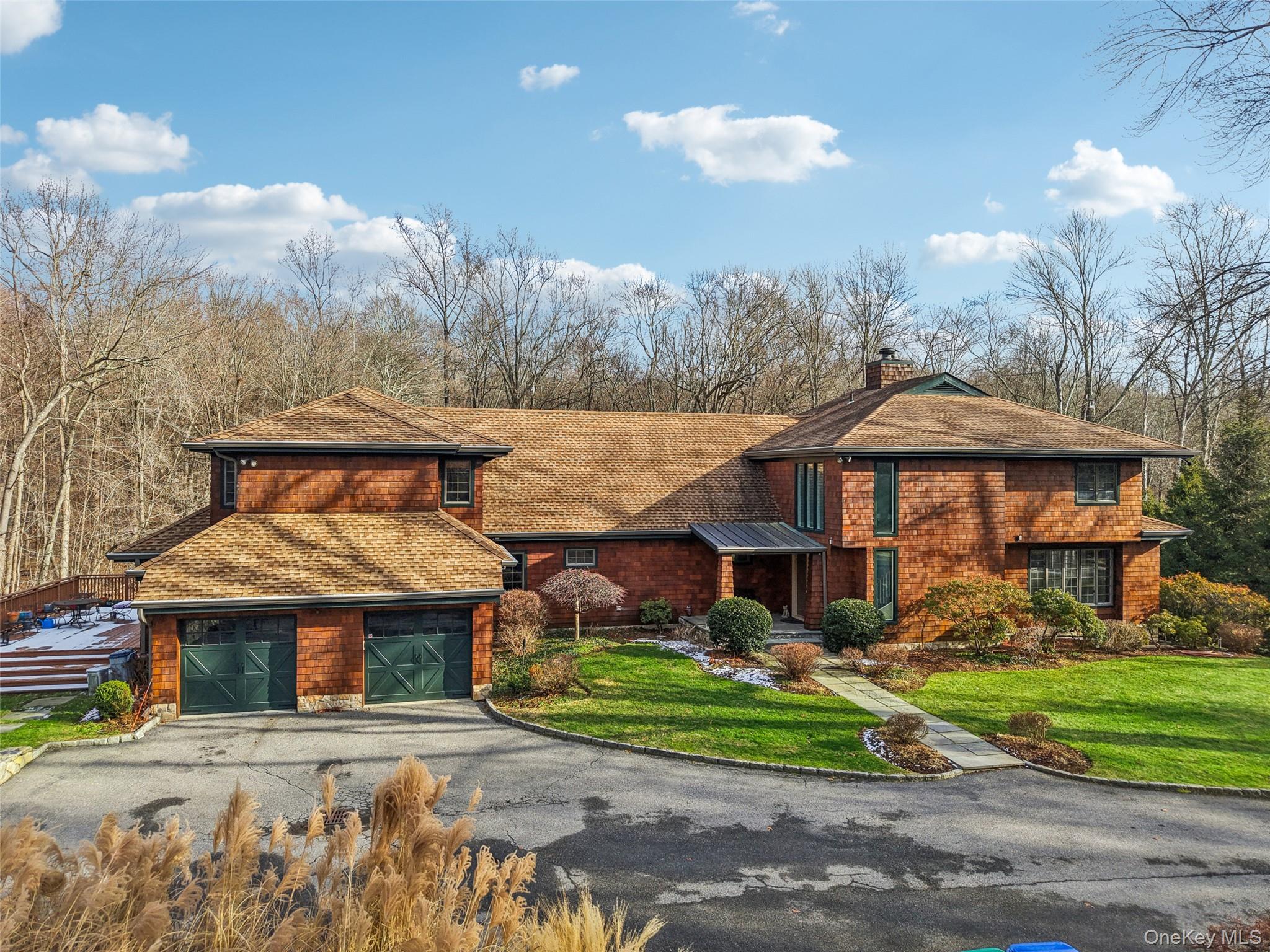 Welcome to 27 Cat Ridge Road—an elegant 6-bedroom estate featuring 3 full baths and 2 powder rooms, gracefully set on 4.5 private, picturesque acres in the heart of North Salem. This exceptional property offers the perfect balance of comfort, sophistication, and convenience. Ideally located just 8 minutes from the Goldens Bridge Metro-North Station and I-684, it provides an easy approximately one-hour commute to New York City, while remaining close to local shops and restaurants. A rare and serene retreat with outstanding accessibility.The main level features multiple living and dining spaces filled with natural light, creating a warm and flexible layout suited for everyday living and entertaining. At the center is the impressive chef’s kitchen with high-end Viking appliances, generous counter space, and ample cabinetry. Just off the main living areas, a charming library room offers a quiet space for reading, work, or relaxation.A standout feature of this home is the dedicated guest area, complete with its own kitchenette and dining room, ideal for extended family, visitors, or an au pair seeking privacy and independence.Upstairs, you’ll find six well-sized bedrooms, including a spacious primary suite. Each room features ample closets and peaceful views of the property. With three full bathrooms and two additional powder rooms, the home comfortably accommodates a full household and guests. Additional interior amenities include a full basement and a dedicated home gym.The exterior of this estate is truly exceptional. The property borders walking and riding trails, adding to its tranquil and natural setting. The grounds include mature plantings and foliage that blooms across three seasons, offering year-round beauty. The inground pool area feels like a private resort and features both a bocce court and horseshoe area for outdoor fun and entertainment. A whole-house generator adds peace of mind and enhances the home’s practicality. A two-car garage and ample driveway parking complete the picture.27 Cat Ridge Road offers remarkable space, privacy, natural beauty, and convenience, an exceptional North Salem estate just minutes from major transportation, trails, and everyday amenities.