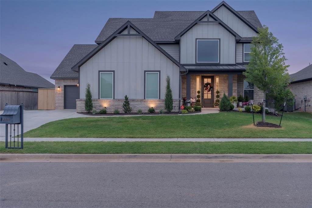 LOAN IS ASSUMABLE AT 5.375%. Nestled on a beautifully landscaped lot within the highly desirable, gated Windstone community, complete with a neighborhood pool and park area, this well-maintained Norman home offers the ultimate blend of modern design and functional luxury. The spectacular open-concept main floor features soaring vaulted ceilings and a stunning, stacked sliding glass backdoor that effortlessly blends indoor and outdoor living by opening to a covered patio with its own brick fireplace. The gourmet kitchen serves as the heart of the home, fully equipped with built-in appliances, a large center island with bar seating, a generous walk-in pantry, and an abundance of sleek cabinetry. Retreat to the main-floor primary suite, where you'll find a massive bedroom and a spa-like en-suite bath complete with a deep soaker tub, a premium upgraded tiled shower, and double vanities. Enjoy the added peace of mind with a walk-in safe room. The home's exterior features permanent, customizable lighting installed around the soffits that you can easily control right from an app on your phone. Finished with a versatile upstairs bonus area perfect for a game room or second living space, and a fully fenced-in backyard, this move-in-ready gem delivers an unparalleled lifestyle in an incredible location—reach out today to schedule your private tour!