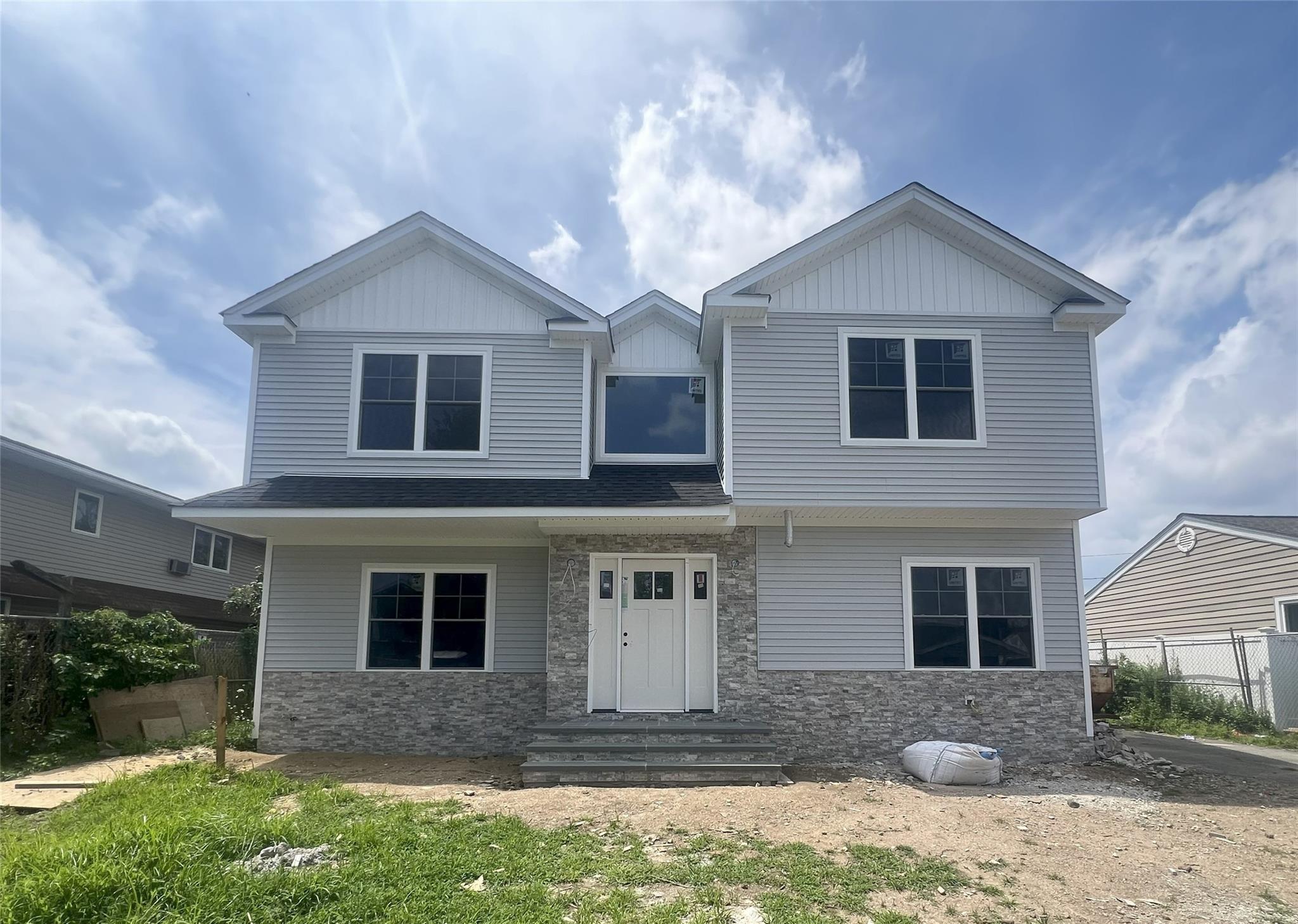 New Construction in Prime Bethpage Location! Discover this beautifully crafted 4-bedroom, 2.5-bath home showcasing superior craftsmanship, high-end finishes, and meticulous attention to detail throughout. Designed with an open and bright layout, this home offers seamless flow and modern comfort. The heart of the home is the stunning chef’s kitchen featuring a large center island, gas cooking, custom cabinetry, and stylish finishes. The spacious den with fireplace and dining and living room areas are filled with natural light and open to the private backyard, perfect for entertaining. Upstairs, retreat to the expansive primary suite with two generous closets and a luxurious  bath. Three additional bedrooms and a full bath offer flexible space for family, guests, or a home office.  This home is the perfect blend of style, function, and location. Still time to customize. Pictures are examples of other homes by this builder. Don’t miss this rare opportunity to own new construction in the heart of Bethpage!