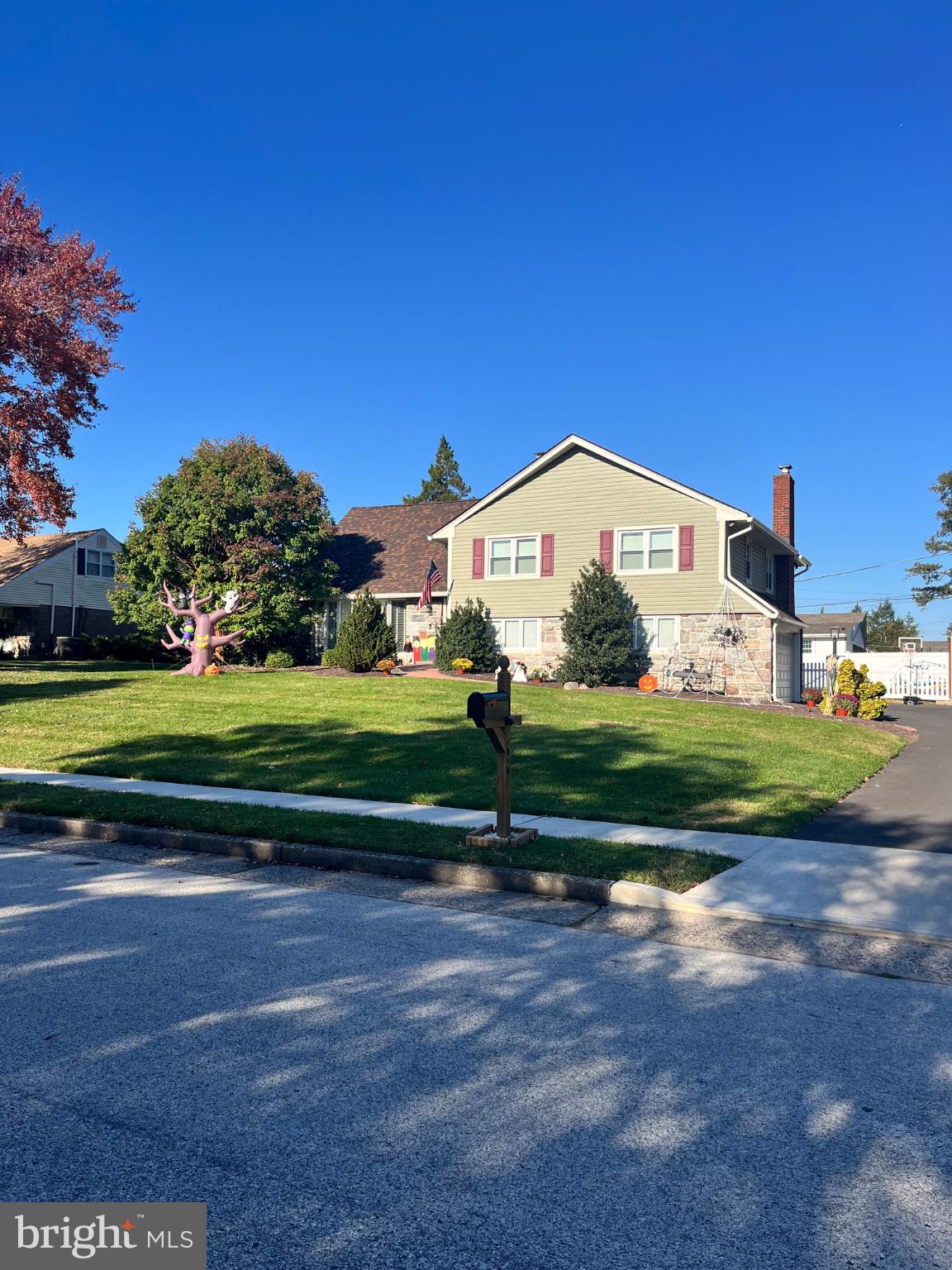 Fantastic opportunity to own a beautifully upgraded home in great Abington neighborhood of Chapel Hill Manor. The home has been updated with all the extras that make you want to move right in! Including newer roof,heater and central air,kitchen island breakfast bar,exterior updates along with mostly newer windows.. Enter the Foyer that leads to the large bright living room with hardwood floors . The upgraded kitchen has neutral wood cabinets and Corian counters,island granite breakfast bar and a large dining space . Sliding doors access the rear paver patio and deck bringing the outside sun right in.  The upper level offers 3 bedrooms and 2 full baths and a 2nd upper level with a 4th bedroom or that bonus space for the home office or gym along with a full bath.  All rooms have good closet space and newer windows.  The lower level family room has a stone fireplace,half bath,great storage closet that makes a perfect toy storage or pantry.  The basement is also finished into a bonus space for all your interests. The rear yard is fully fenced with a play area,patio and grilling area and a deck. Lots of space for enjoying the outdoor life. Even space for a dog run!  This really is a beautiful home! Do not miss it!